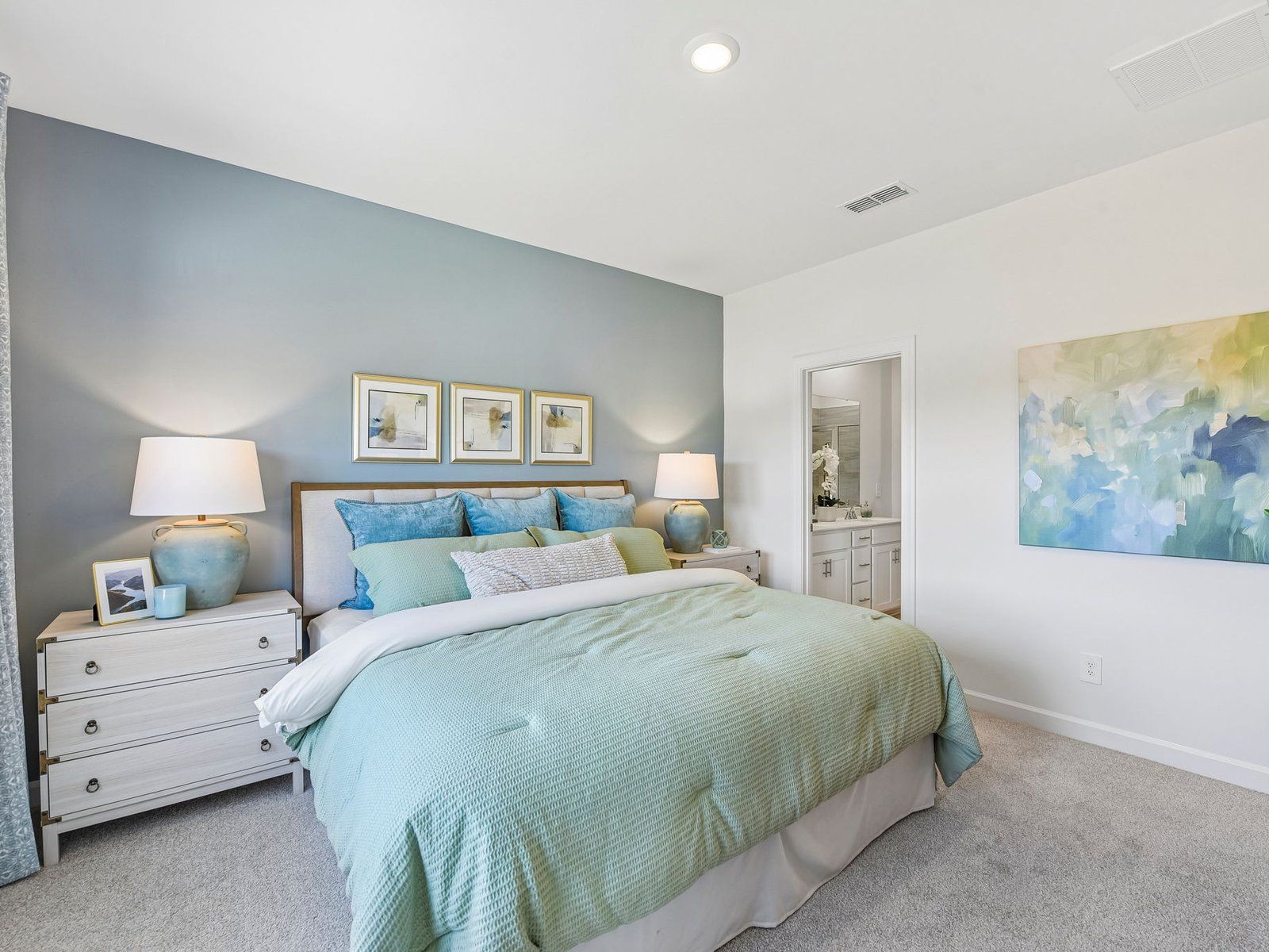 Relax and unwind in the downstairs primary bedroom.