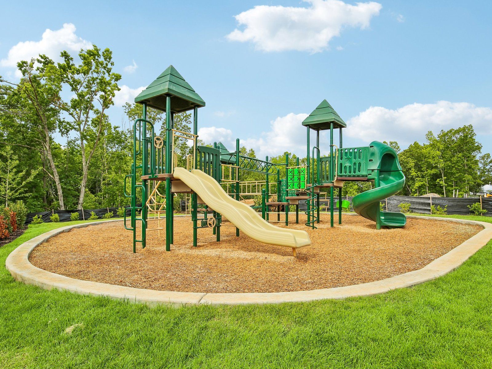 Enjoy community amenities at Cedarcrest Townhomes including a playground.