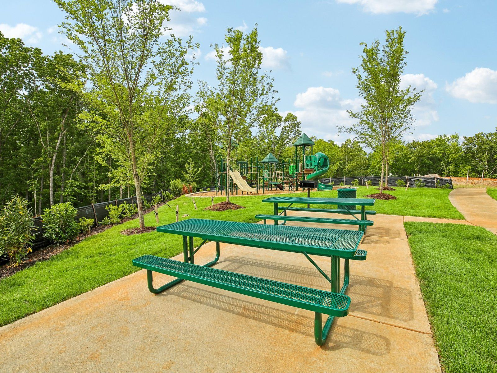Enjoy community amenities at Cedarcrest Townhomes including a playground.