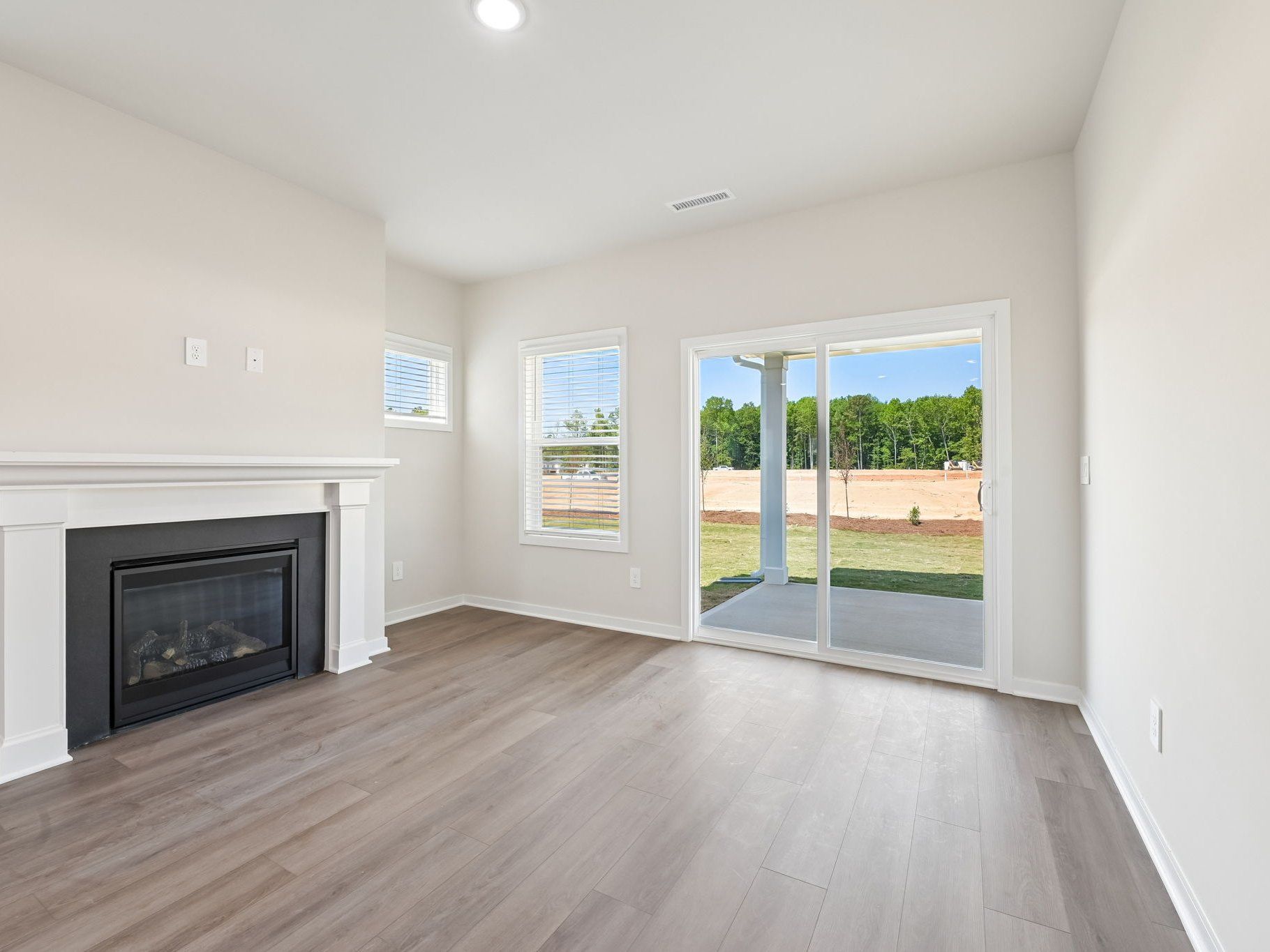 Great room in the Roswell floorplan at a Meritage Homes community in Wendell, NC.