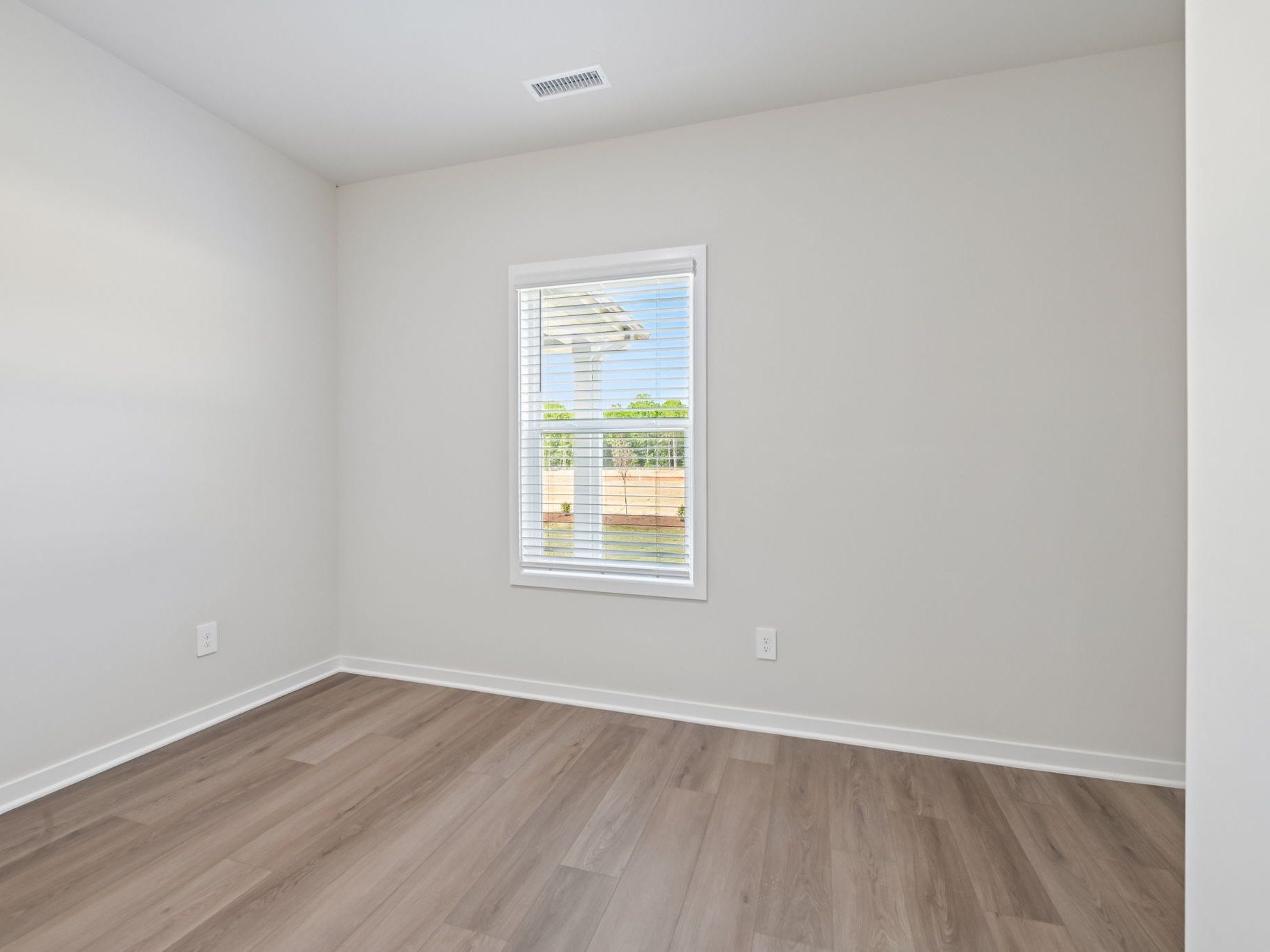 Secondary bedroom in the Roswell floorplan at a Meritage Homes community in Wendell, NC.