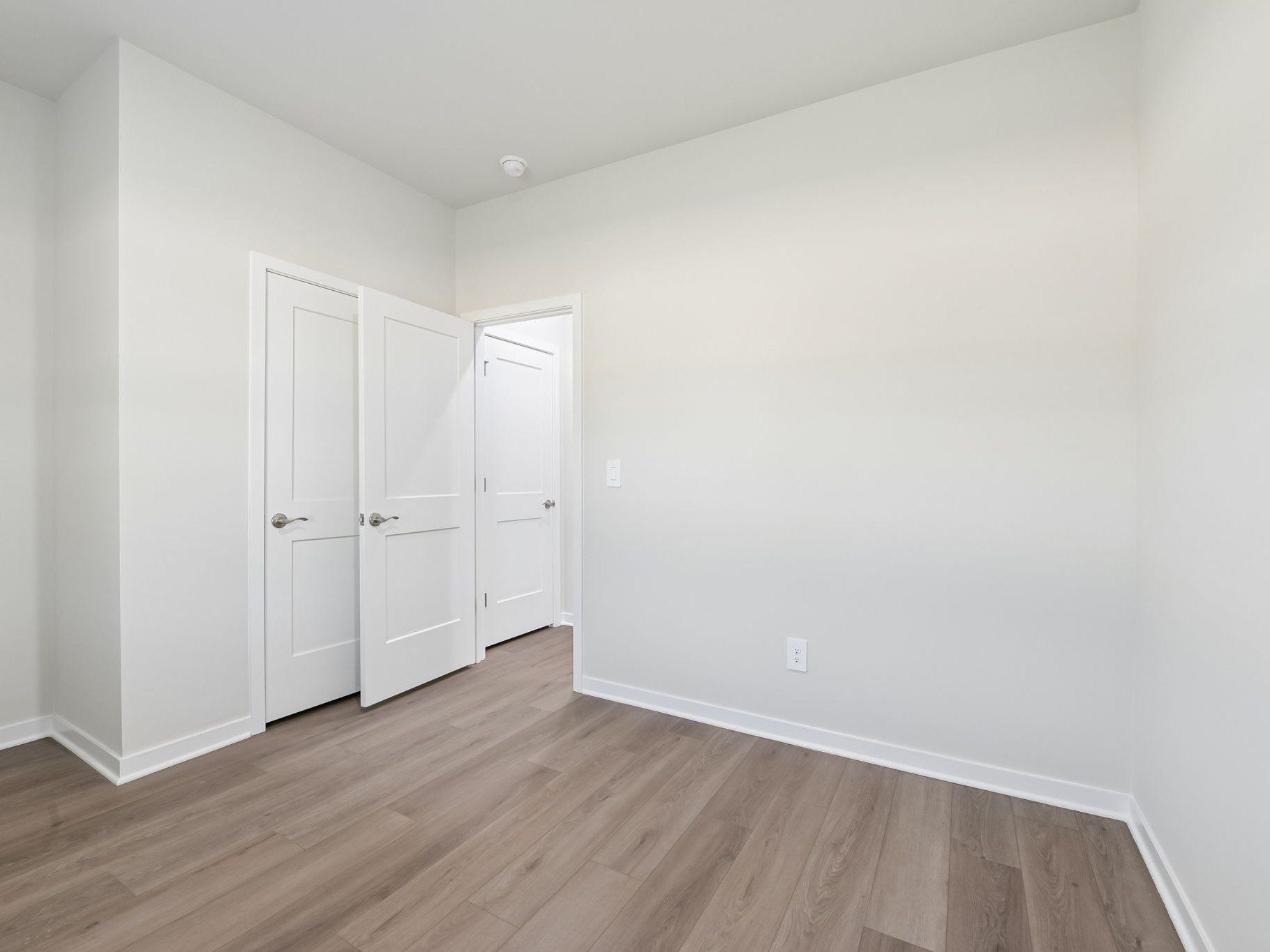 Secondary bedroom in the Roswell floorplan at a Meritage Homes community in Wendell, NC.