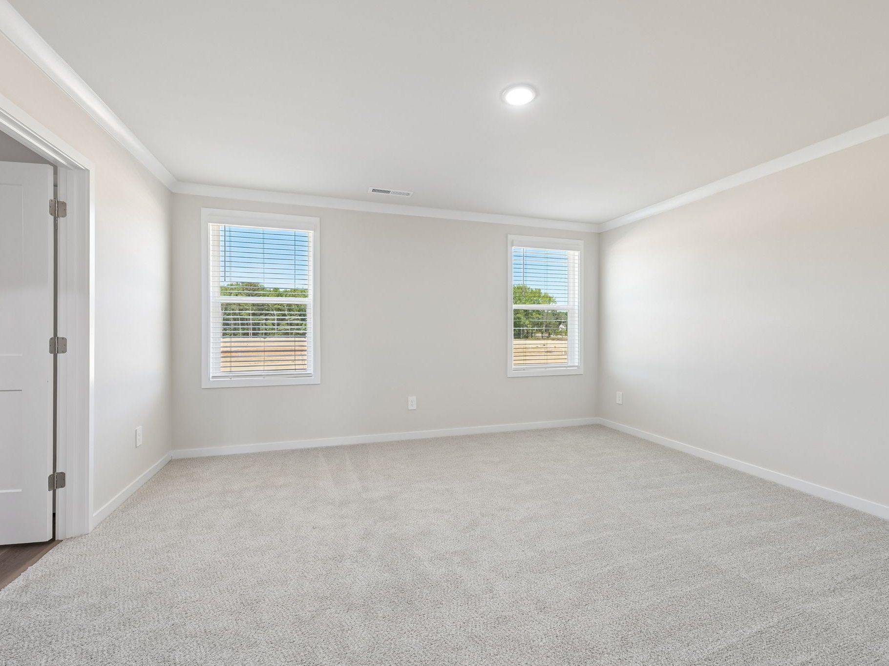 Primary bedroom in the Roswell floorplan at a Meritage Homes community in Wendell, NC.