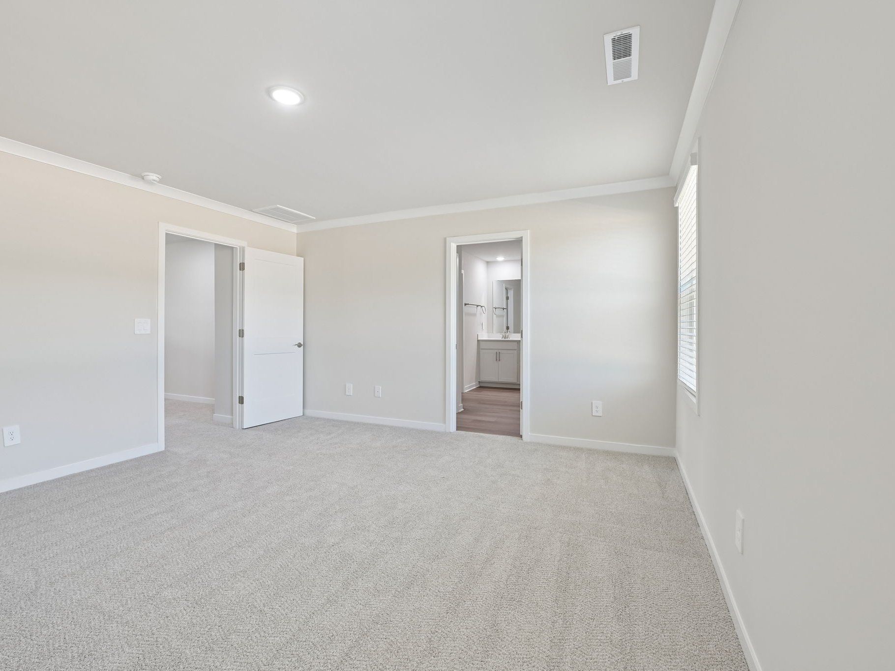 Primary bedroom in the Roswell floorplan at a Meritage Homes community in Wendell, NC.
