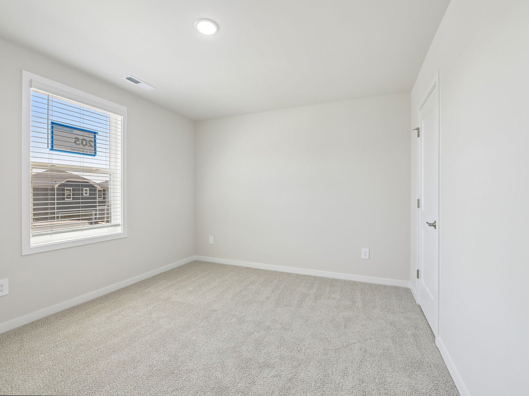 Secondary bedroom in the Roswell floorplan at a Meritage Homes community in Wendell, NC.
