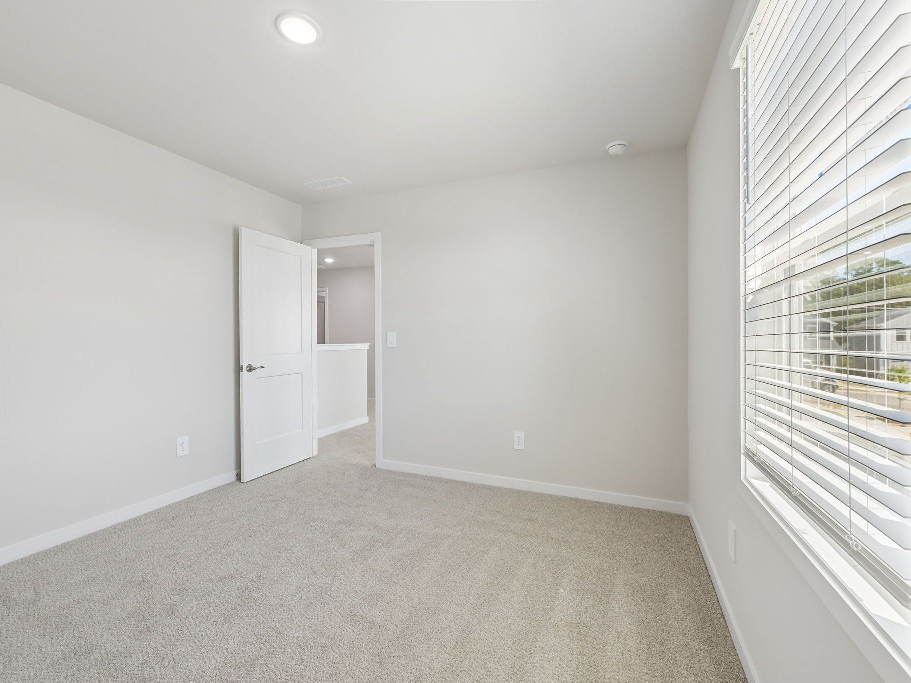 Secondary bedroom in the Roswell floorplan at a Meritage Homes community in Wendell, NC.