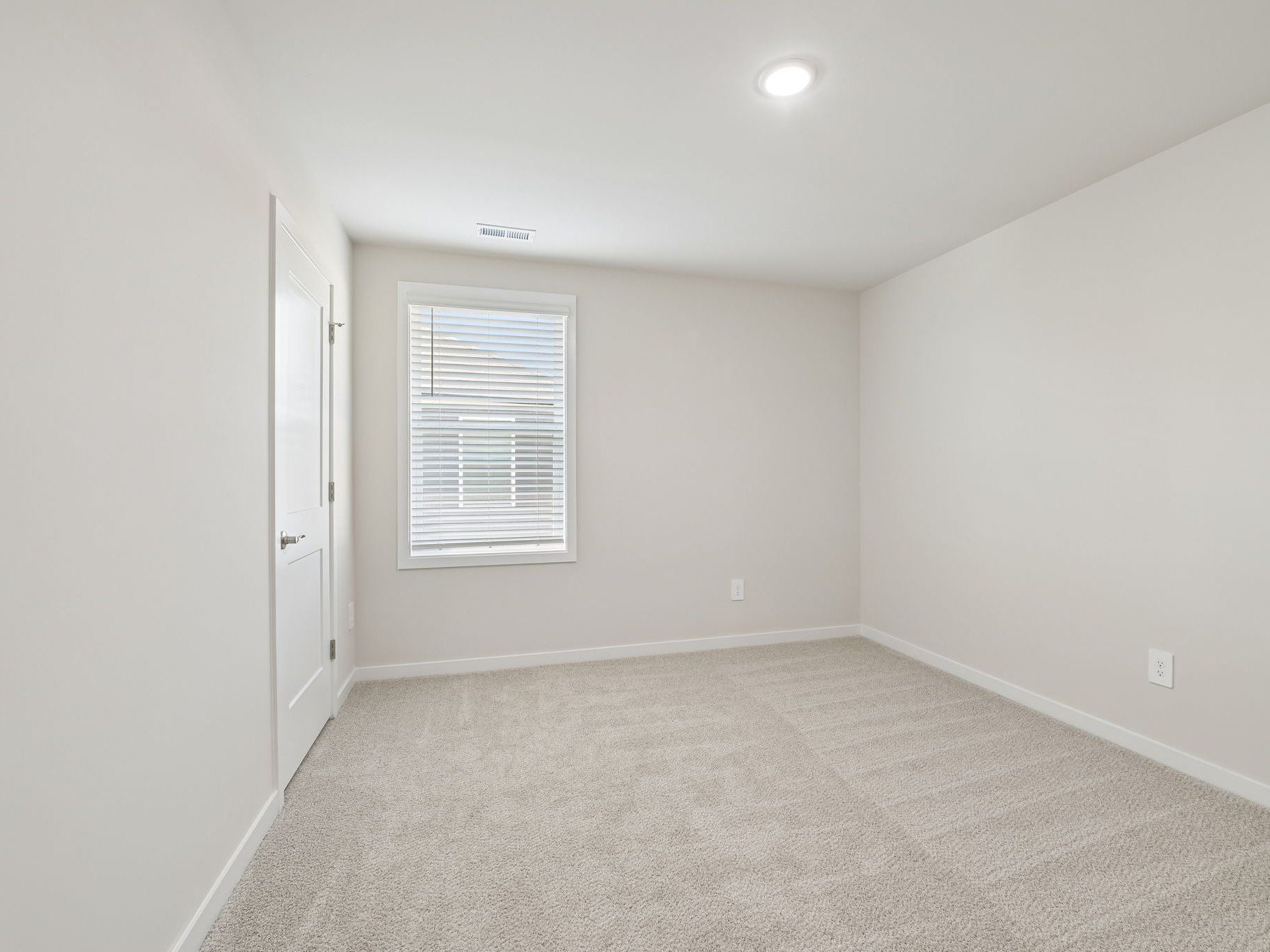 Secondary bedroom in the Roswell floorplan at a Meritage Homes community in Wendell, NC.