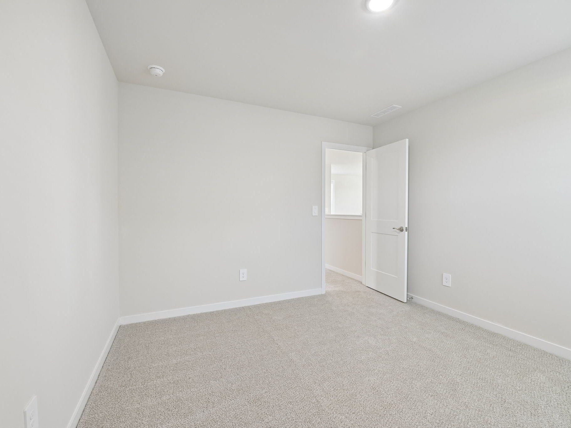 Secondary bedroom in the Roswell floorplan at a Meritage Homes community in Wendell, NC.