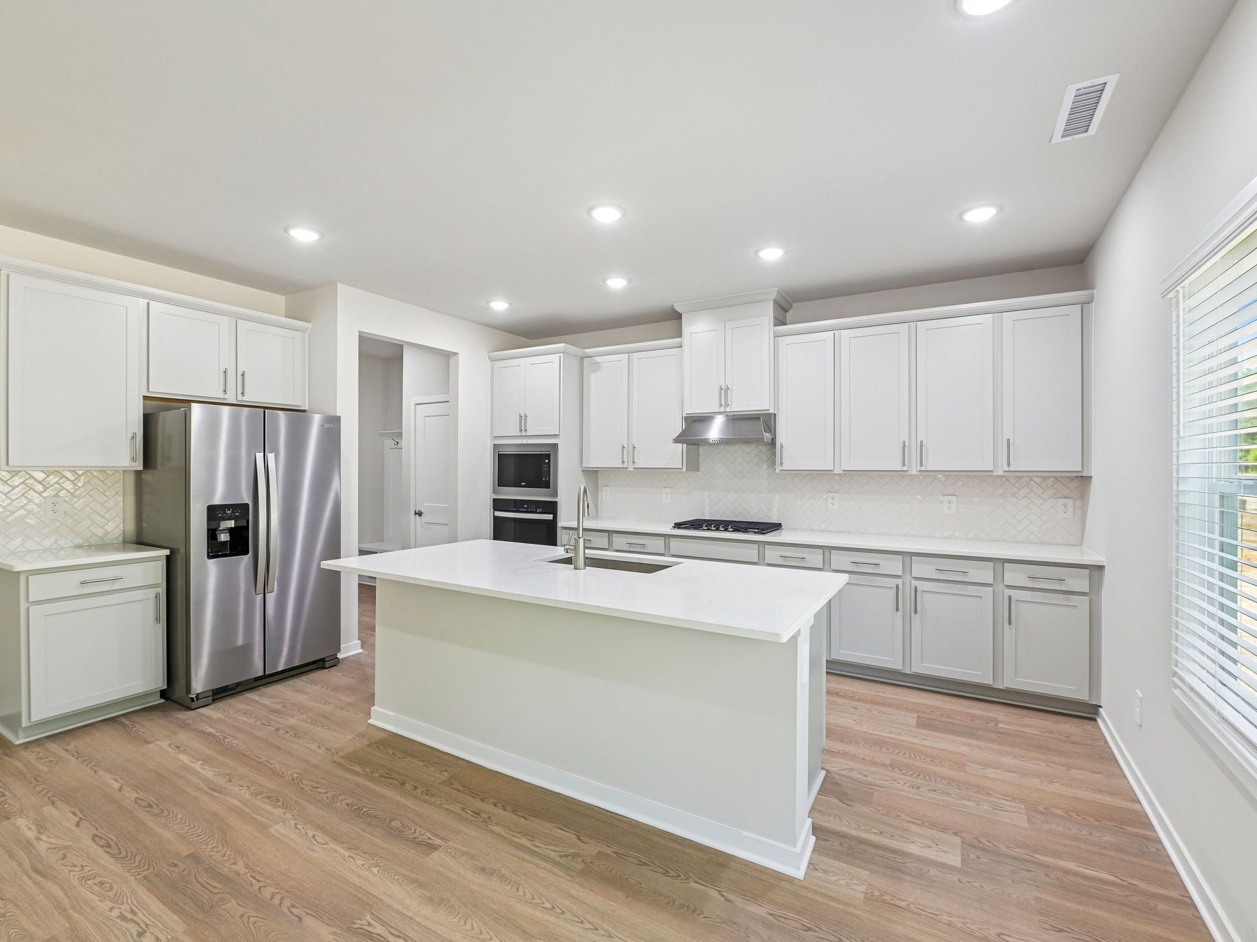 Kitchen the Taylorsville floorplan at a Meritage Homes community in Wendell, NC.