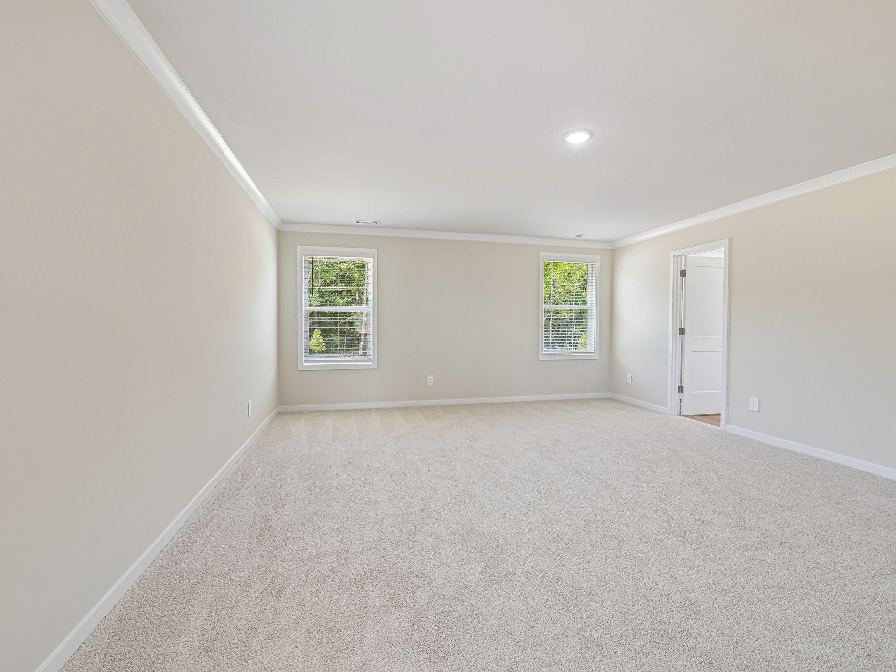 Primary bedroom in the Taylorsville floorplan at a Meritage Homes community in Wendell, NC.