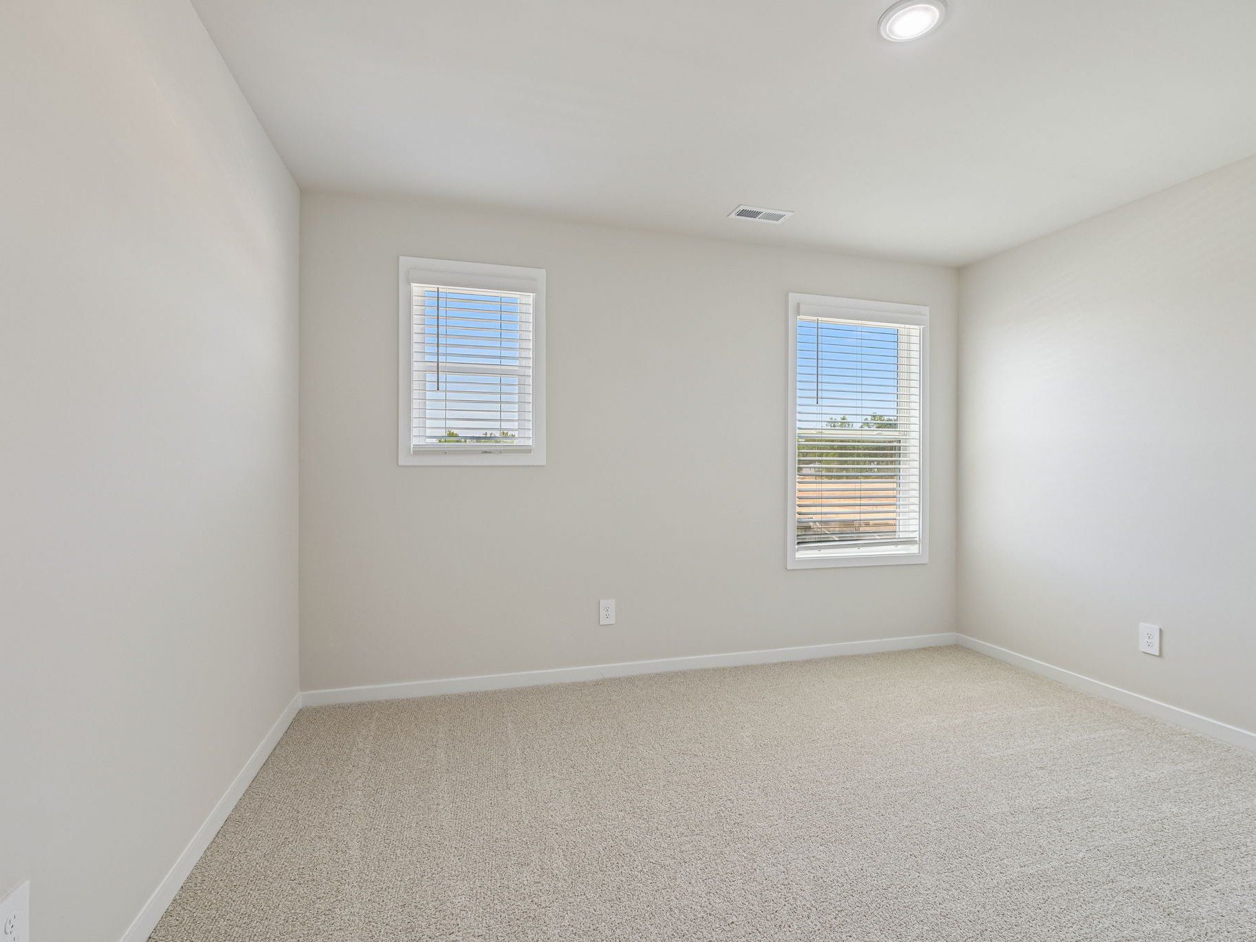 Secondary bedroom in the Taylorsville floorplan at a Meritage Homes community in Wendell, NC.
