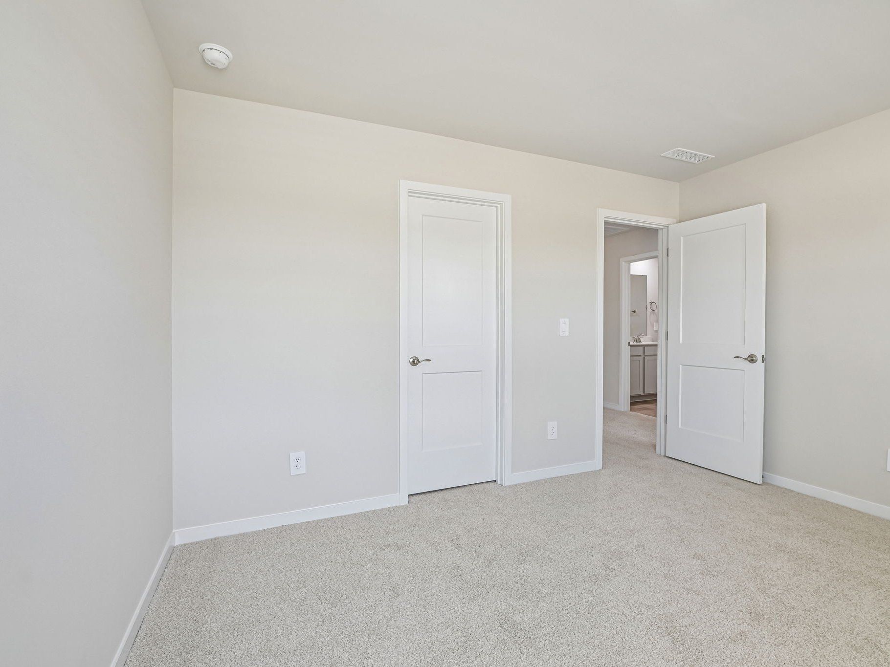 Secondary bedroom in the Taylorsville floorplan at a Meritage Homes community in Wendell, NC.