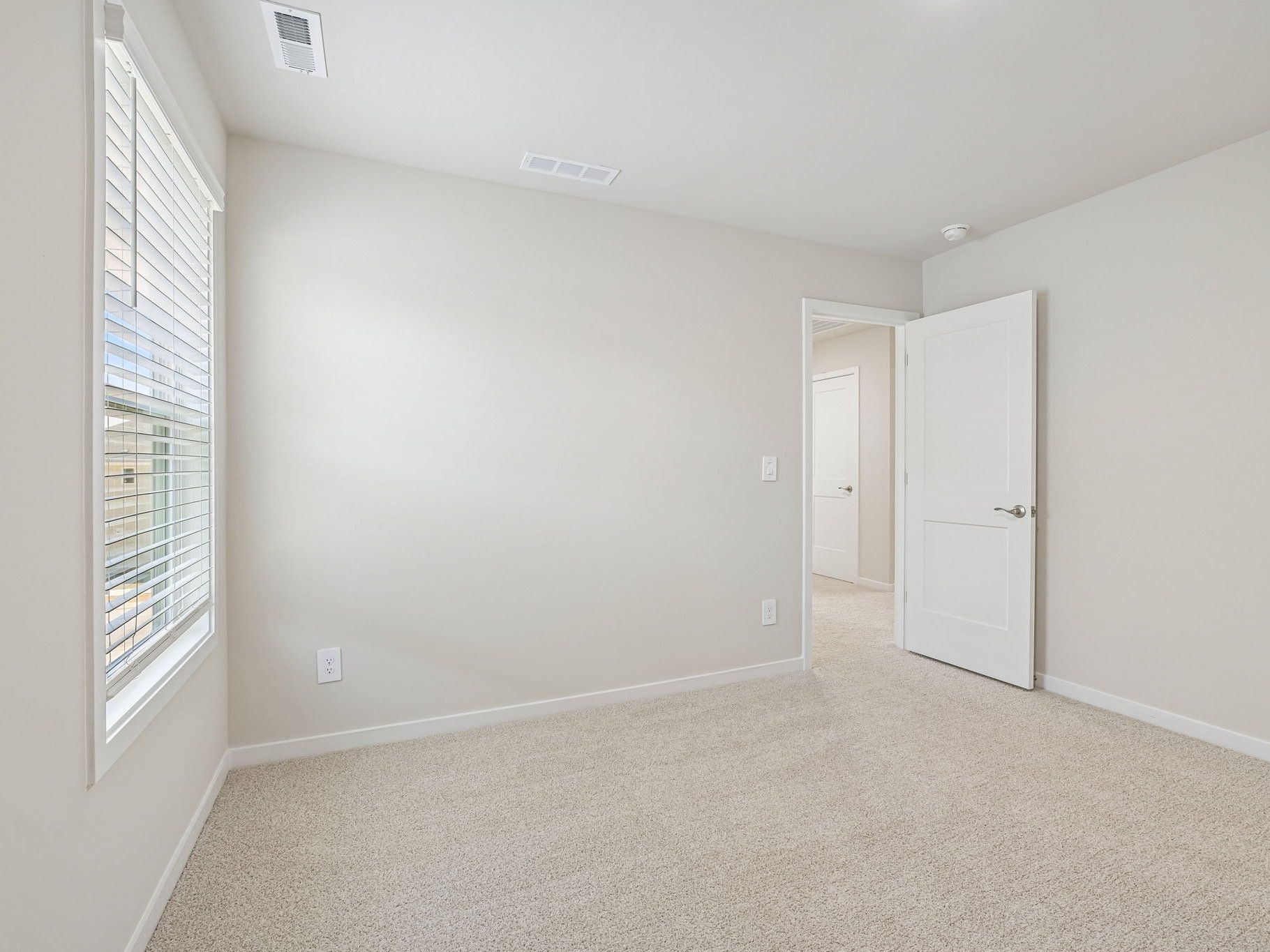 Secondary bedroom in the Taylorsville floorplan at a Meritage Homes community in Wendell, NC.