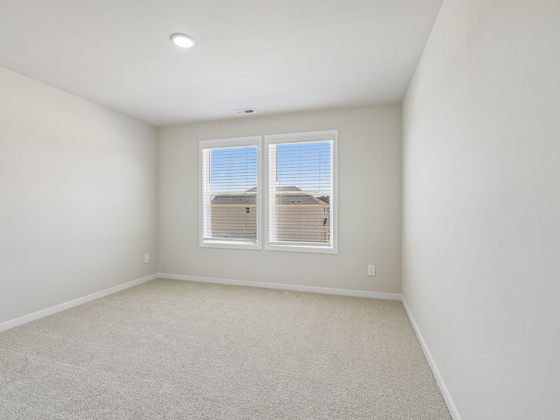 Secondary bedroom in the Taylorsville floorplan at a Meritage Homes community in Wendell, NC.