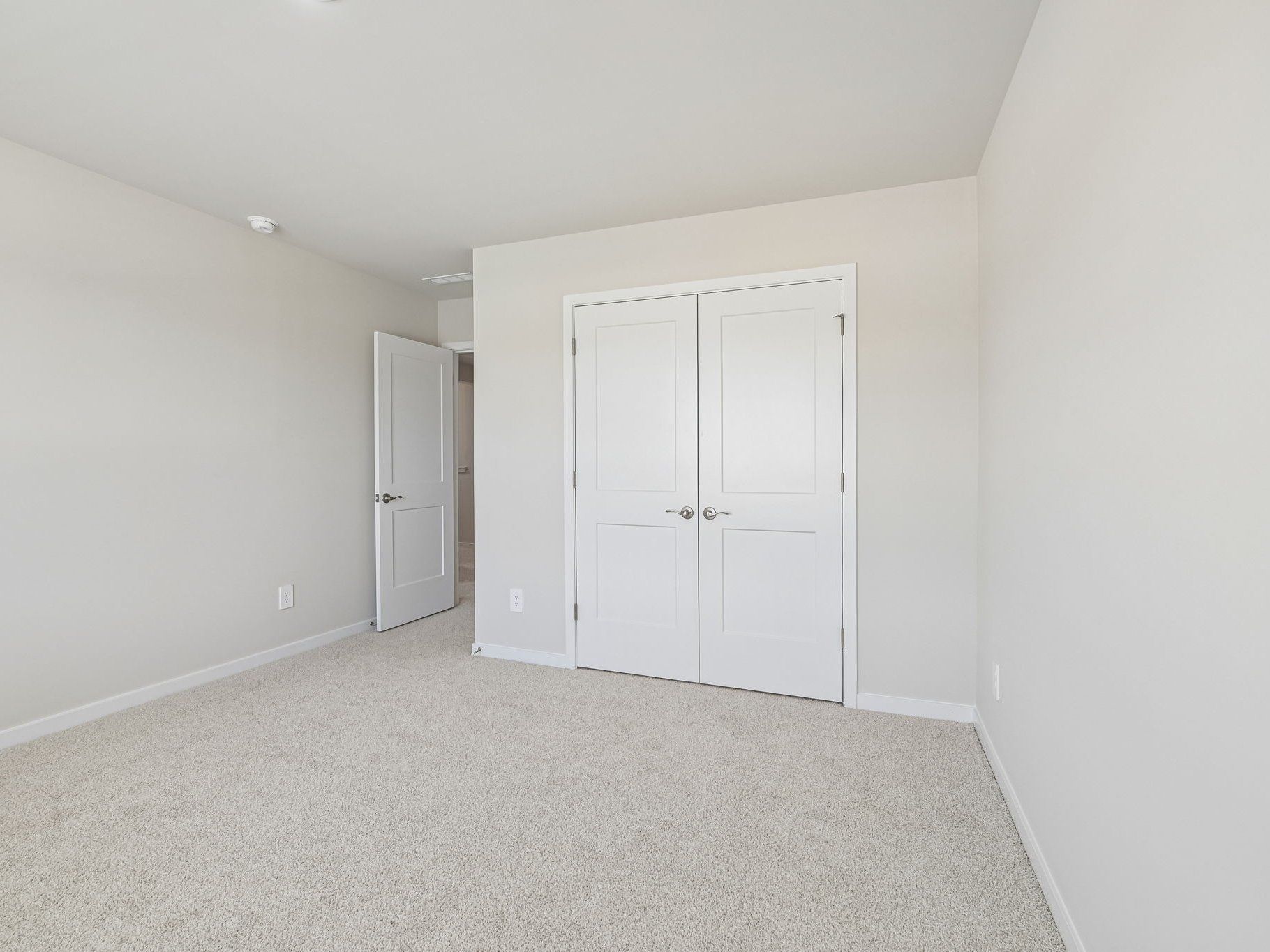 Secondary bedroom in the Taylorsville floorplan at a Meritage Homes community in Wendell, NC.