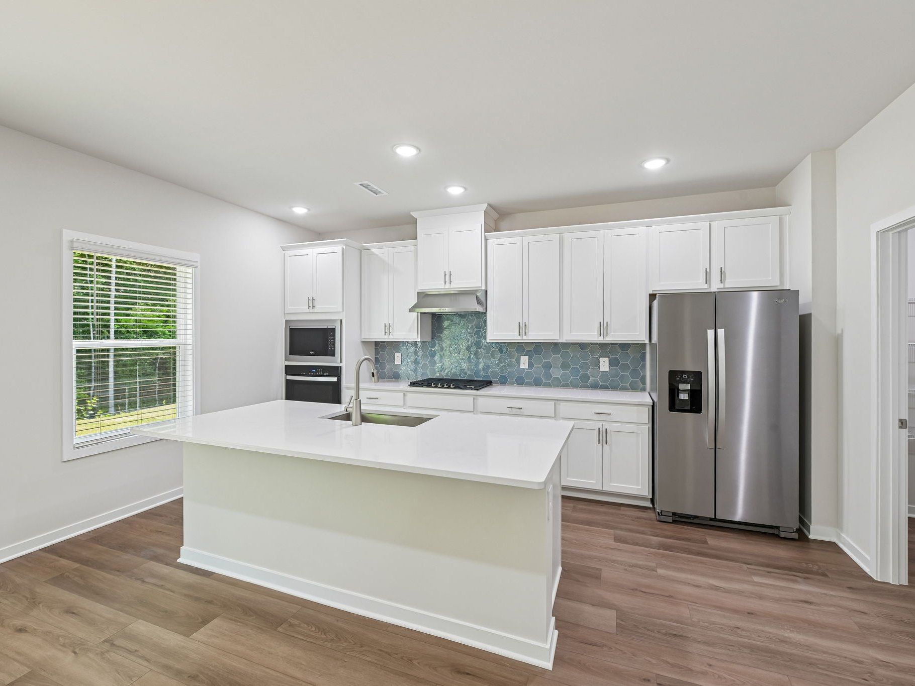 Kitchen in the Lakeland floorplan at a Meritage Homes community in Zebulon, NC.
