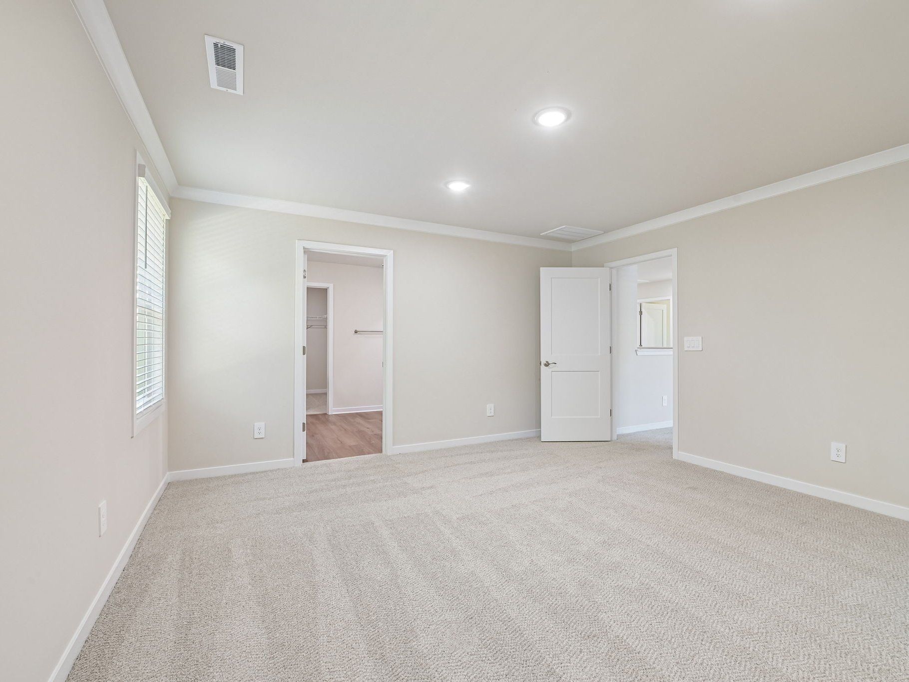 Primary bedroom in the Lakeland floorplan at a Meritage Homes community in Zebulon, NC.