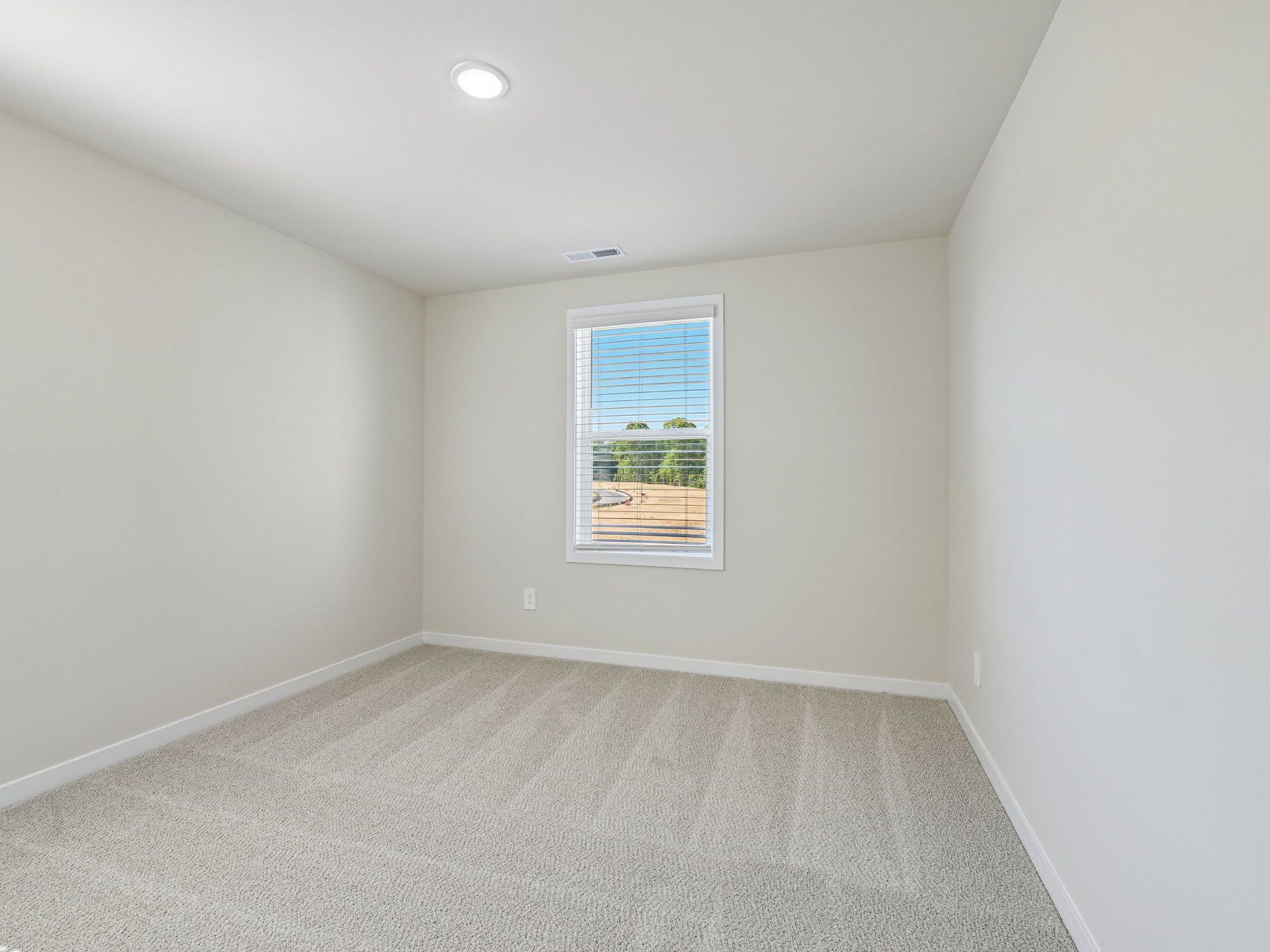 Secondary bedroom in the Lakeland floorplan at a Meritage Homes community in Zebulon, NC.
