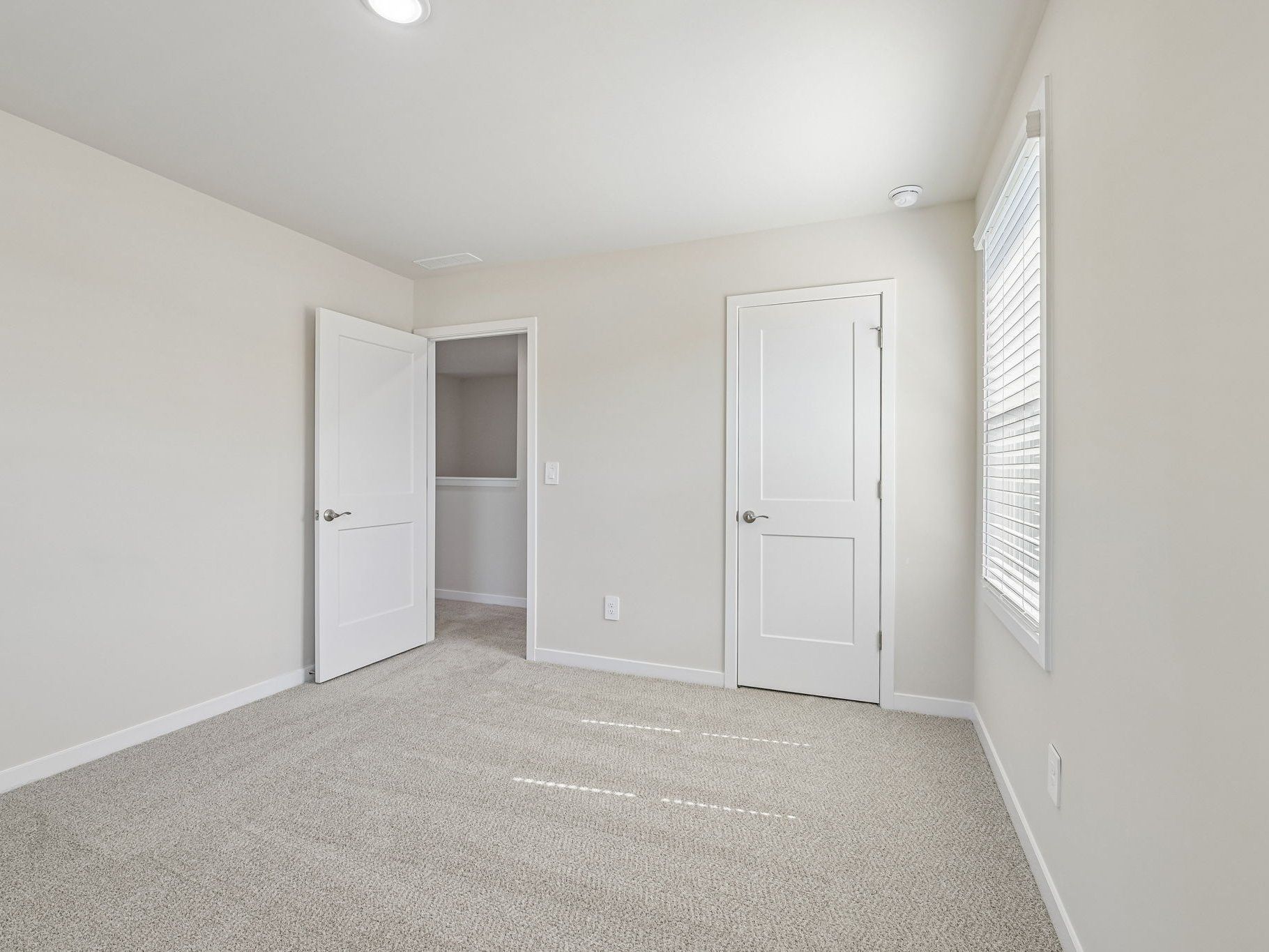 Secondary bedroom in the Lakeland floorplan at a Meritage Homes community in Zebulon, NC.