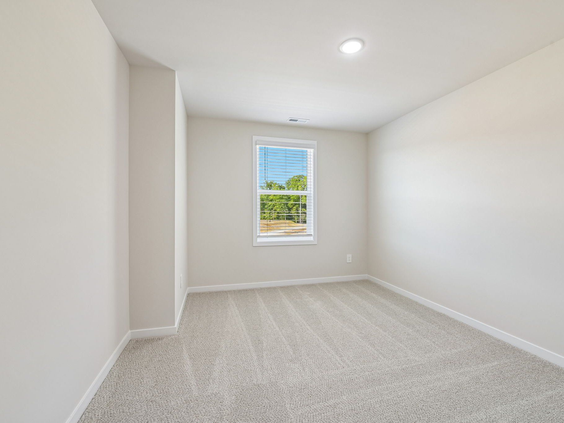 Secondary bedroom in the Lakeland floorplan at a Meritage Homes community in Zebulon, NC.