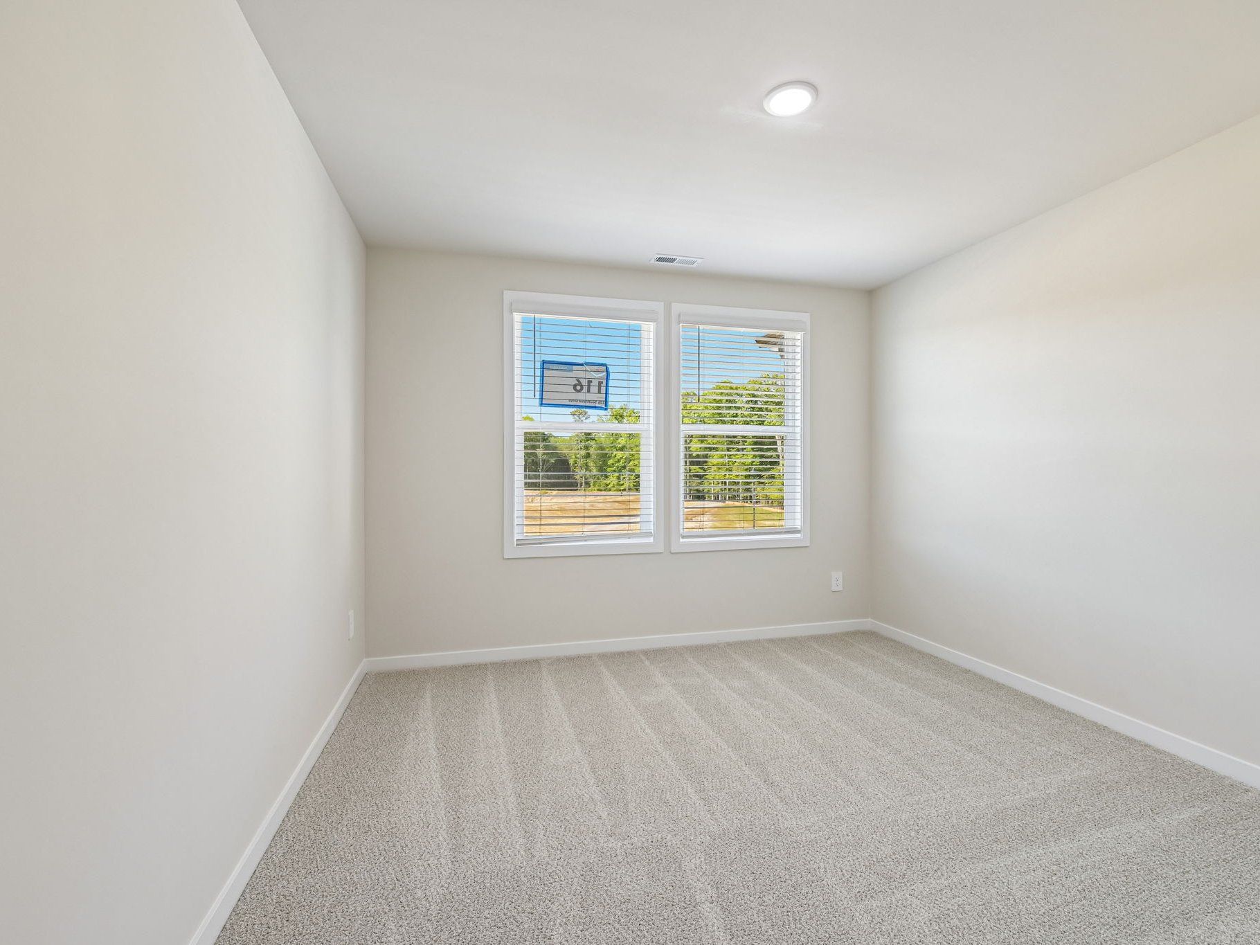 Secondary bedroom in the Lakeland floorplan at a Meritage Homes community in Zebulon, NC.