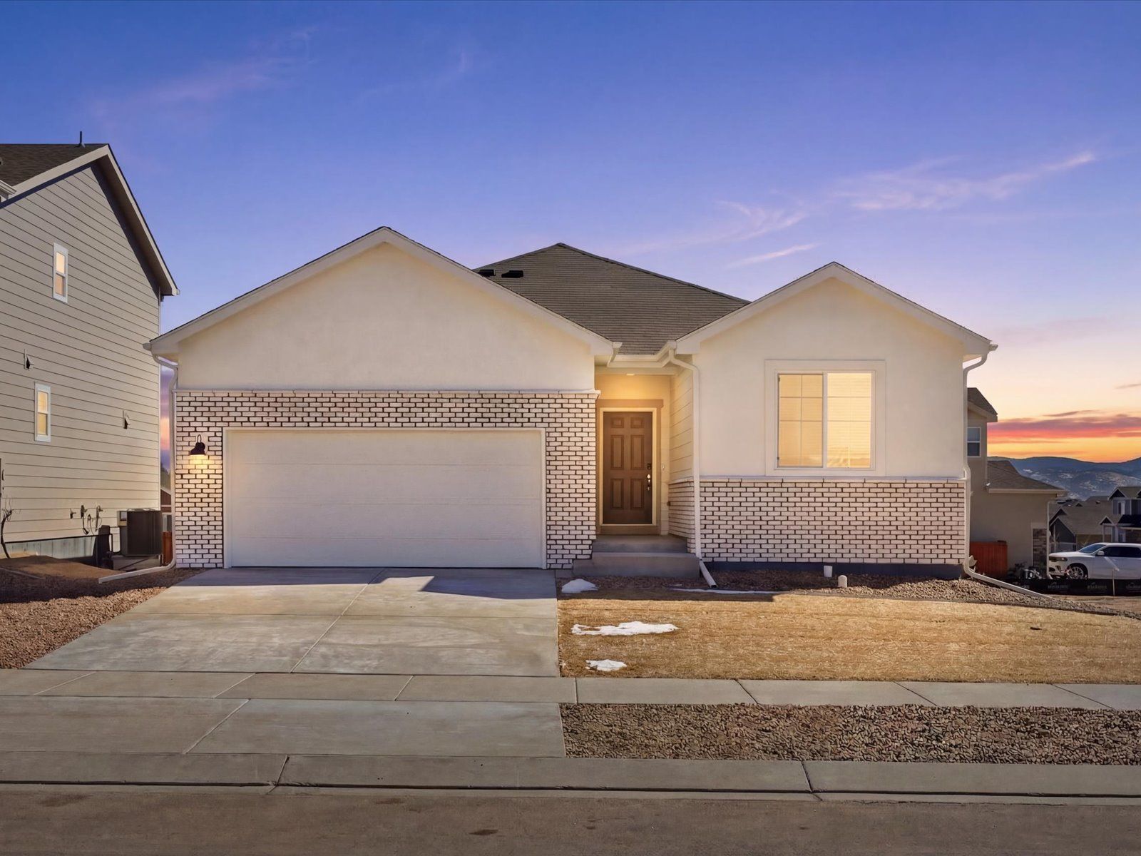 DEN_Meridian-Ranch-50's-LN_Red-Feather_Facade-Twilight_B_13219-Valley-Peak-Dr