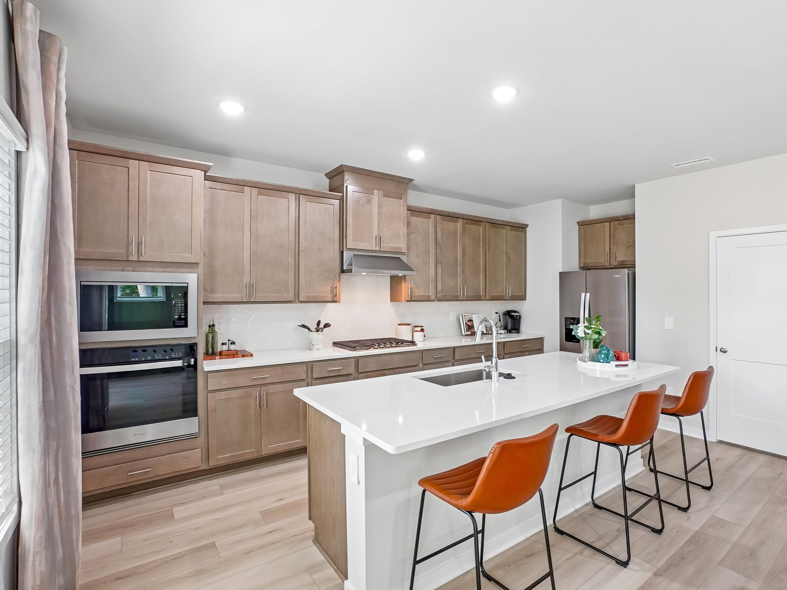 Kitchen in the Wilson floorplan at a Meritage Homes community in Zebulon, NC.