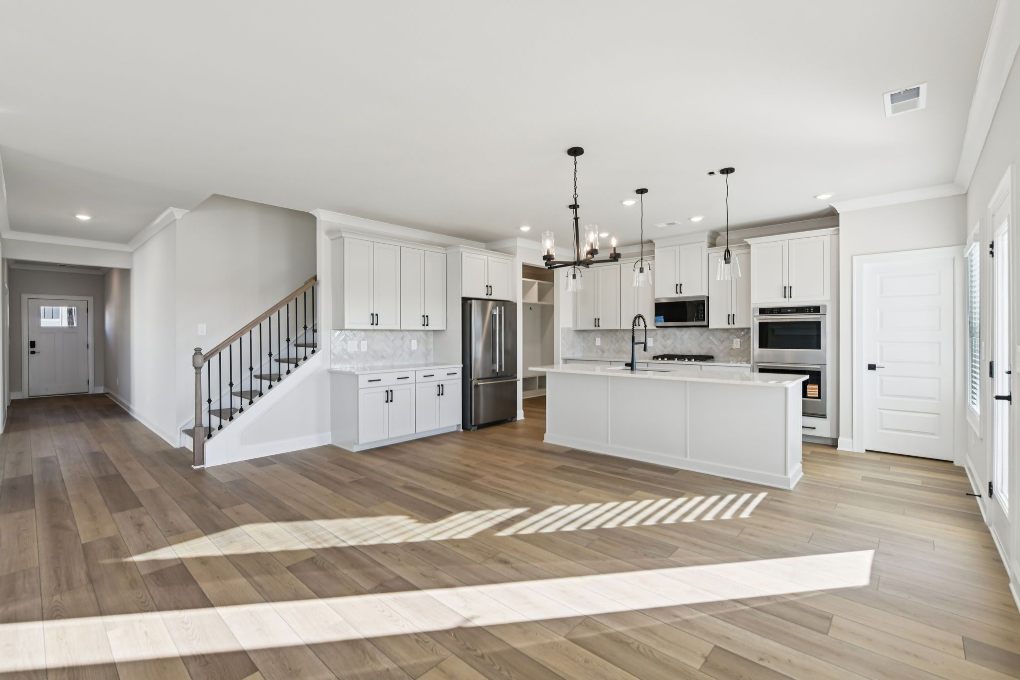 The Redford floorplan with the Fresh Artisan Harbor interior package modeled at Vines at Mill Creek.