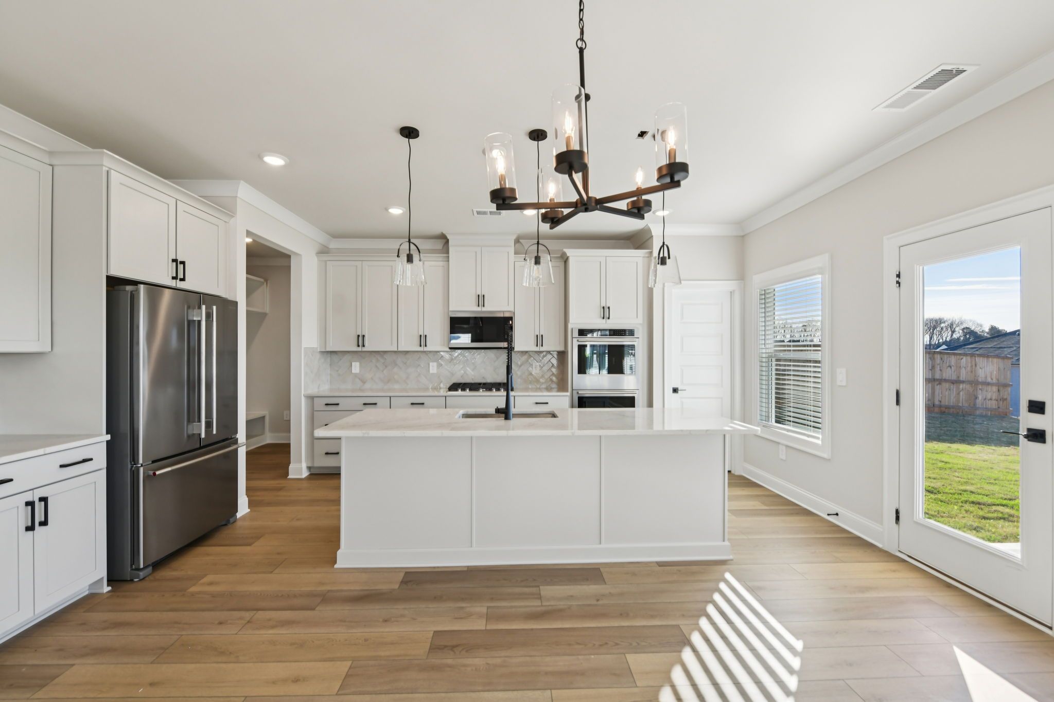 The Redford floorplan with the Fresh Artisan Harbor interior package modeled at Vines at Mill Creek.