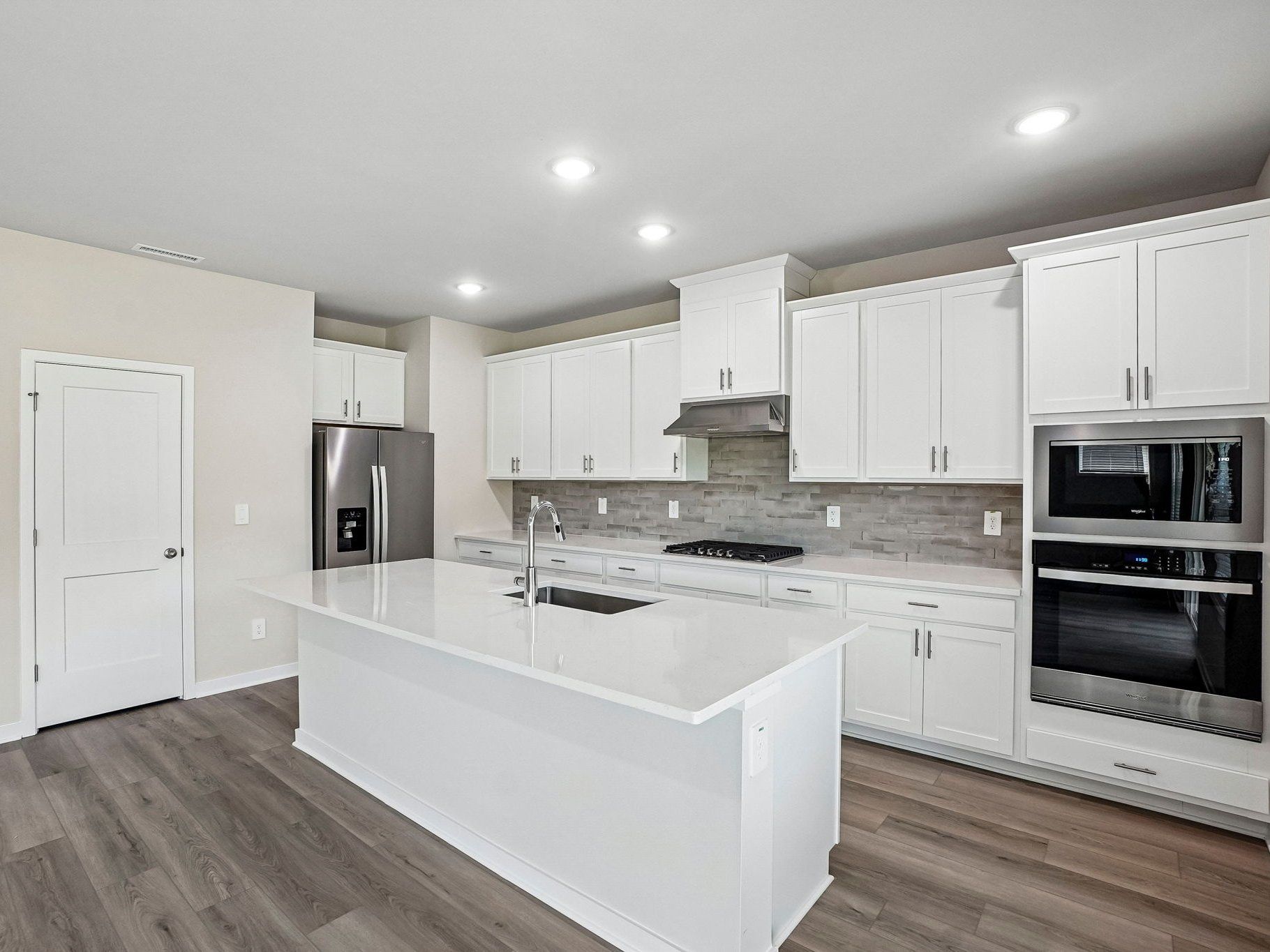 Kitchen in the Wilson floorplan at a Meritage Homes community in Clayton, NC.