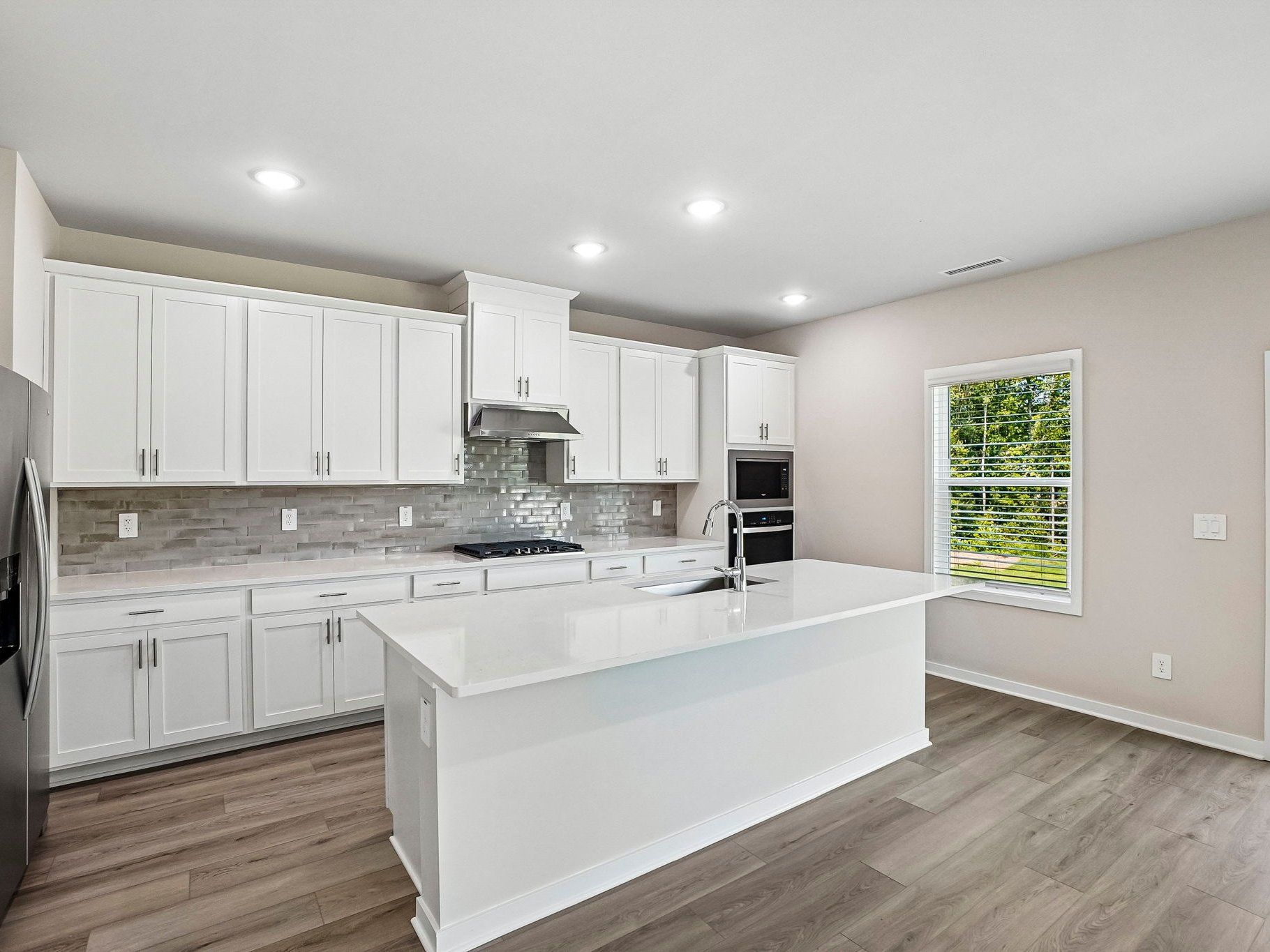 Kitchen in the Wilson floorplan at a Meritage Homes community in Clayton, NC.