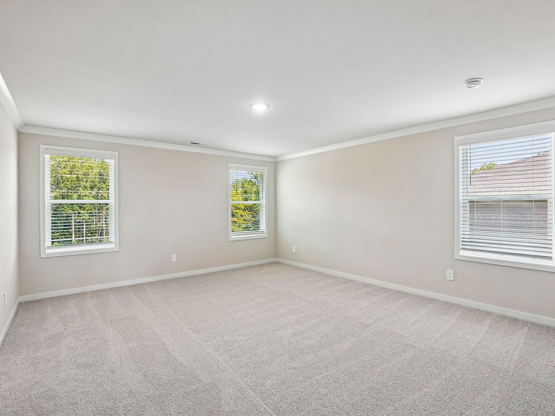 Primary bedroom in the Wilson floorplan at a Meritage Homes community in Clayton, NC.