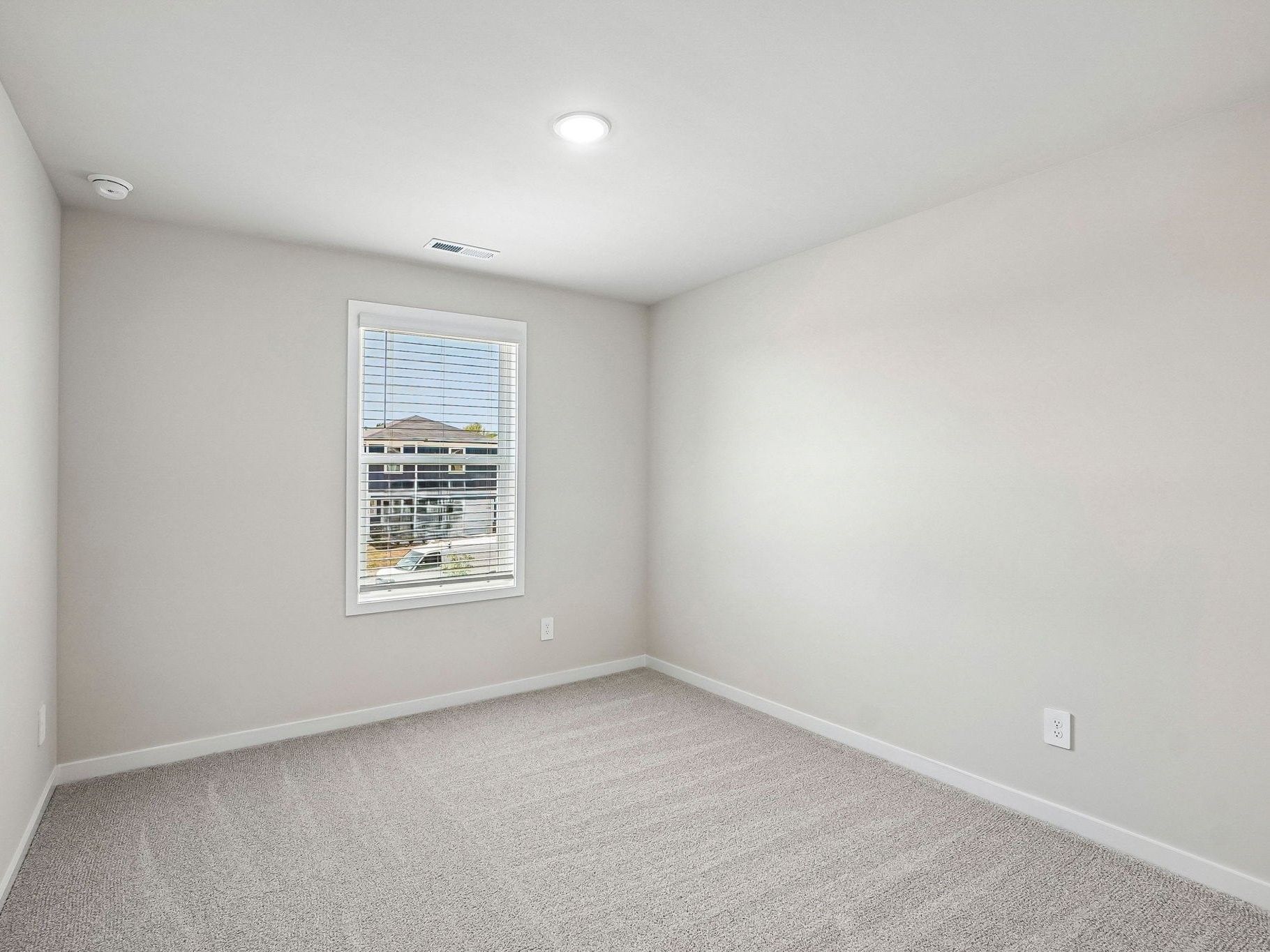Secondary bedroom in the Wilson floorplan at a Meritage Homes community in Clayton, NC.