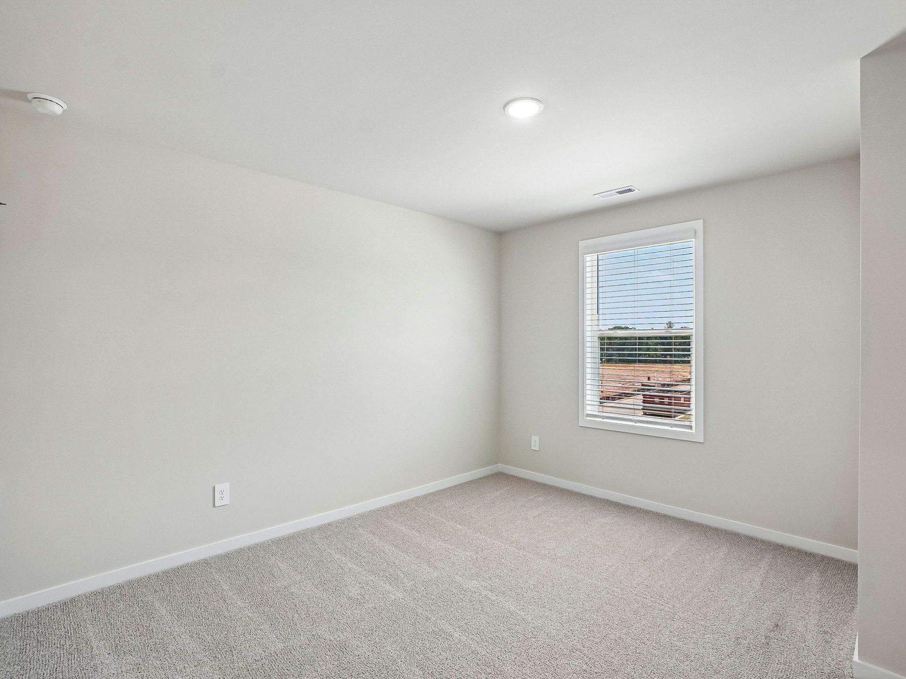 Secondary bedroom in the Wilson floorplan at a Meritage Homes community in Clayton, NC.