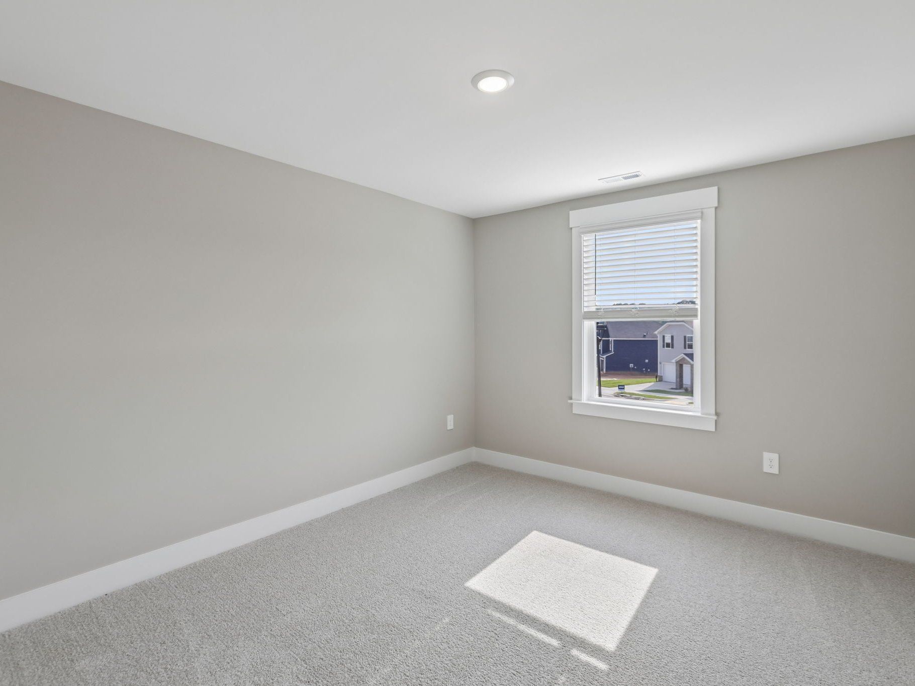 Secondary bedroom in the Brentwood floorplan at a Meritage Homes community in Raleigh, NC.