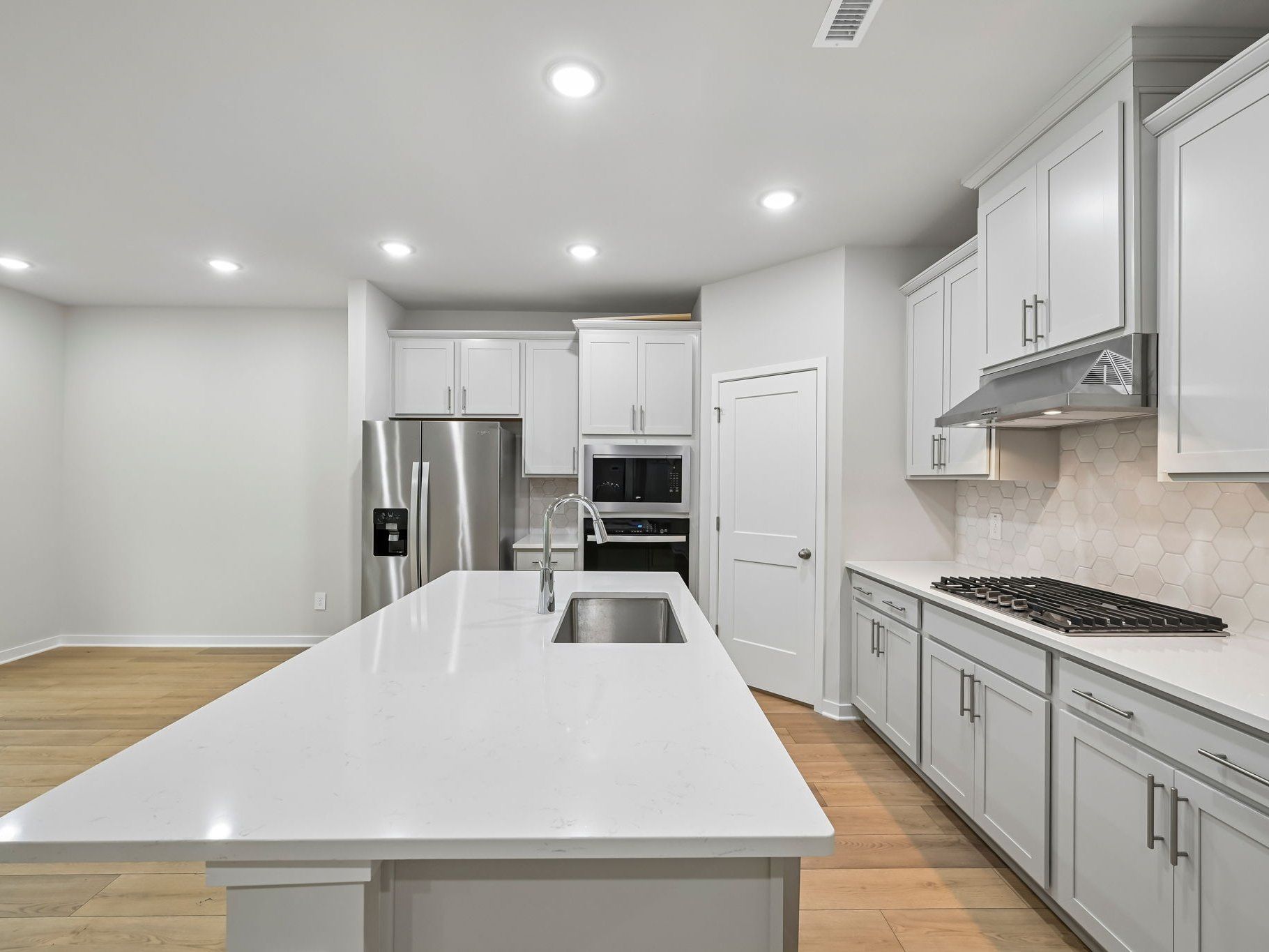 Kitchen in the Chatham floorplan at a Meritage Homes community in Wendell, NC.