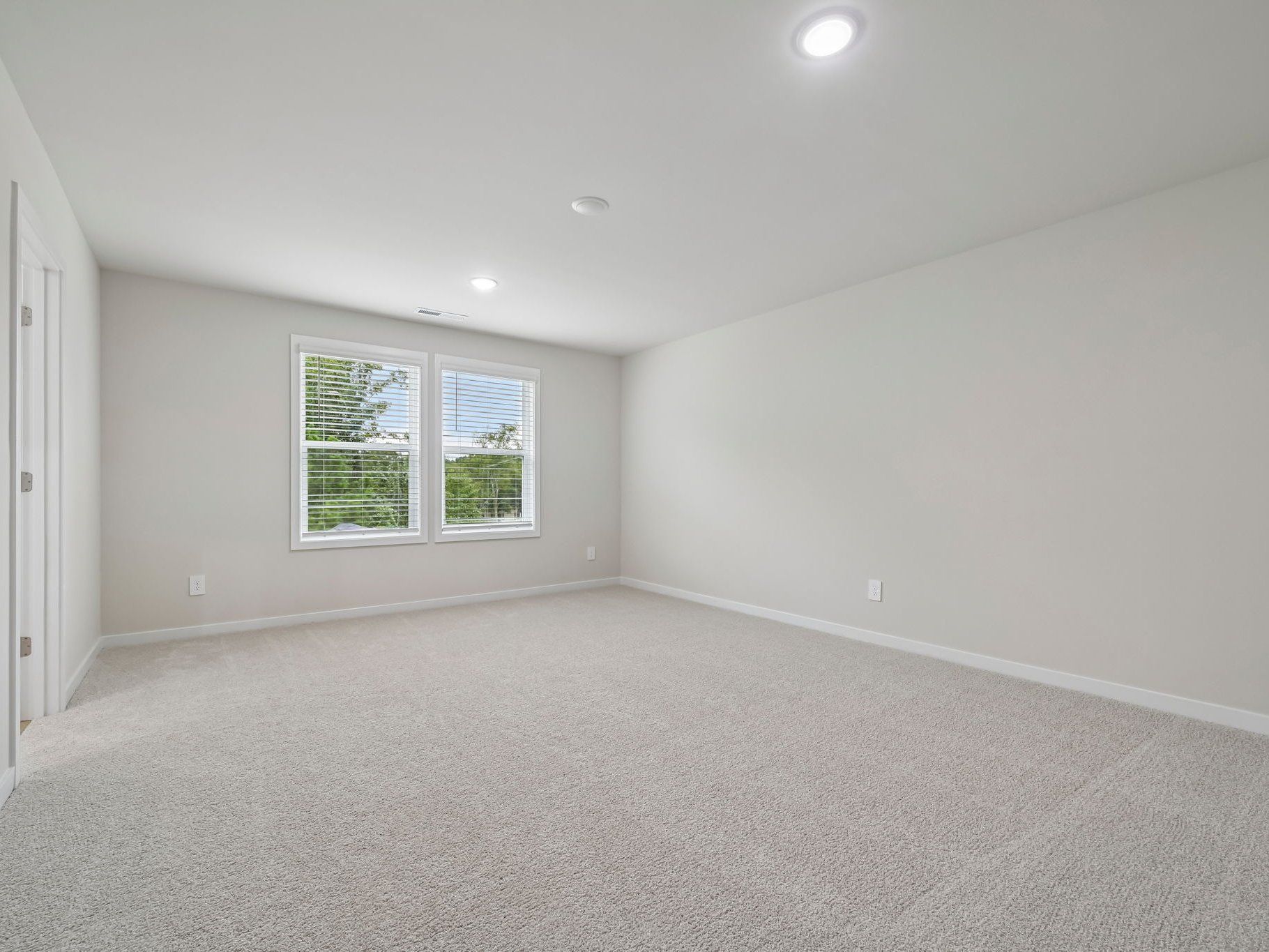 Primary bedroom in the Chatham floorplan at a Meritage Homes community in Wendell, NC.