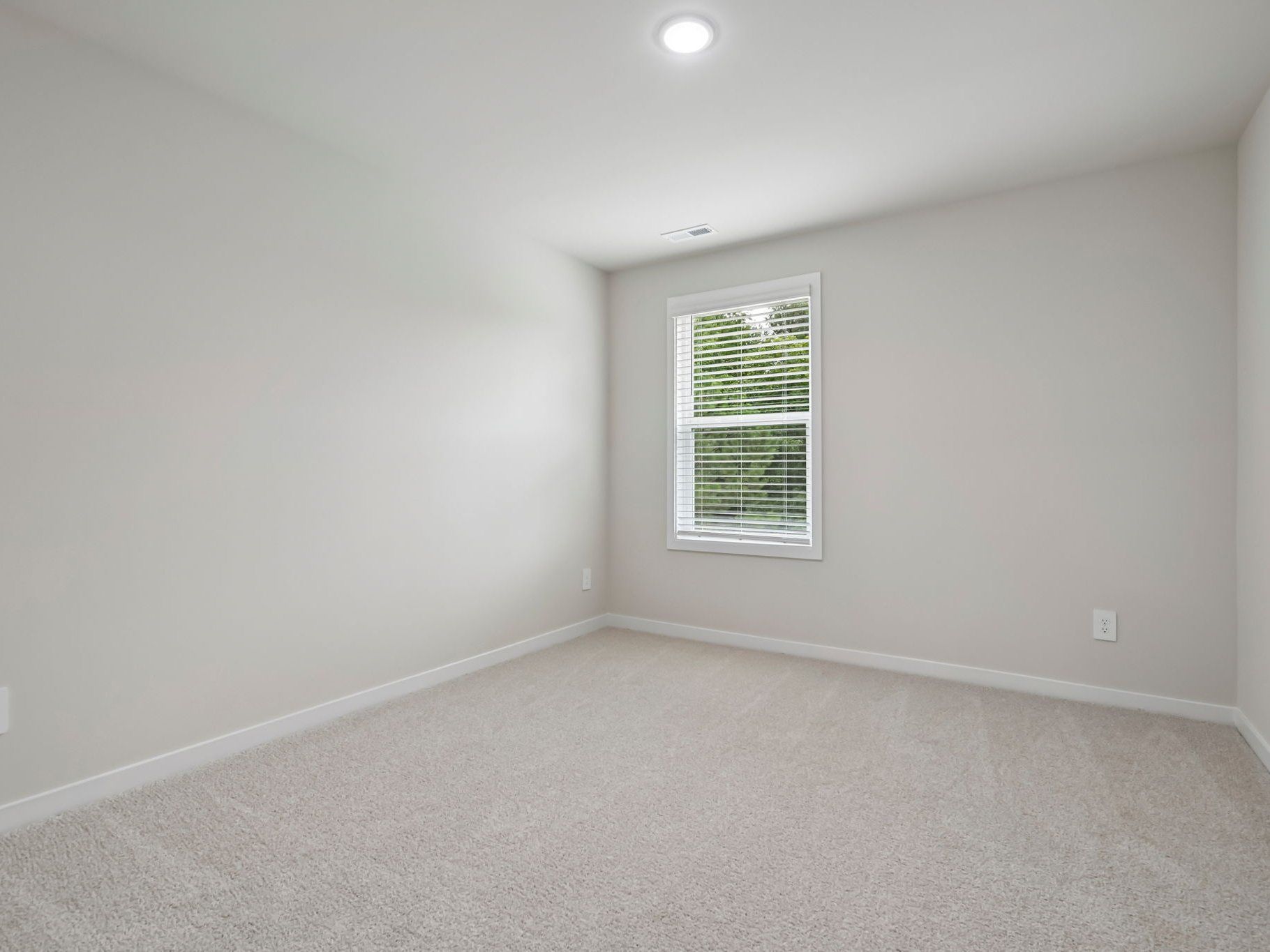 Secondary bedroom in the Chatham floorplan at a Meritage Homes community in Wendell, NC.