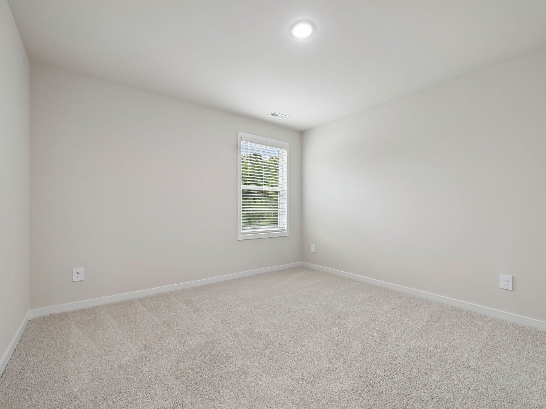 Secondary bedroom in the Chatham floorplan at a Meritage Homes community in Wendell, NC.