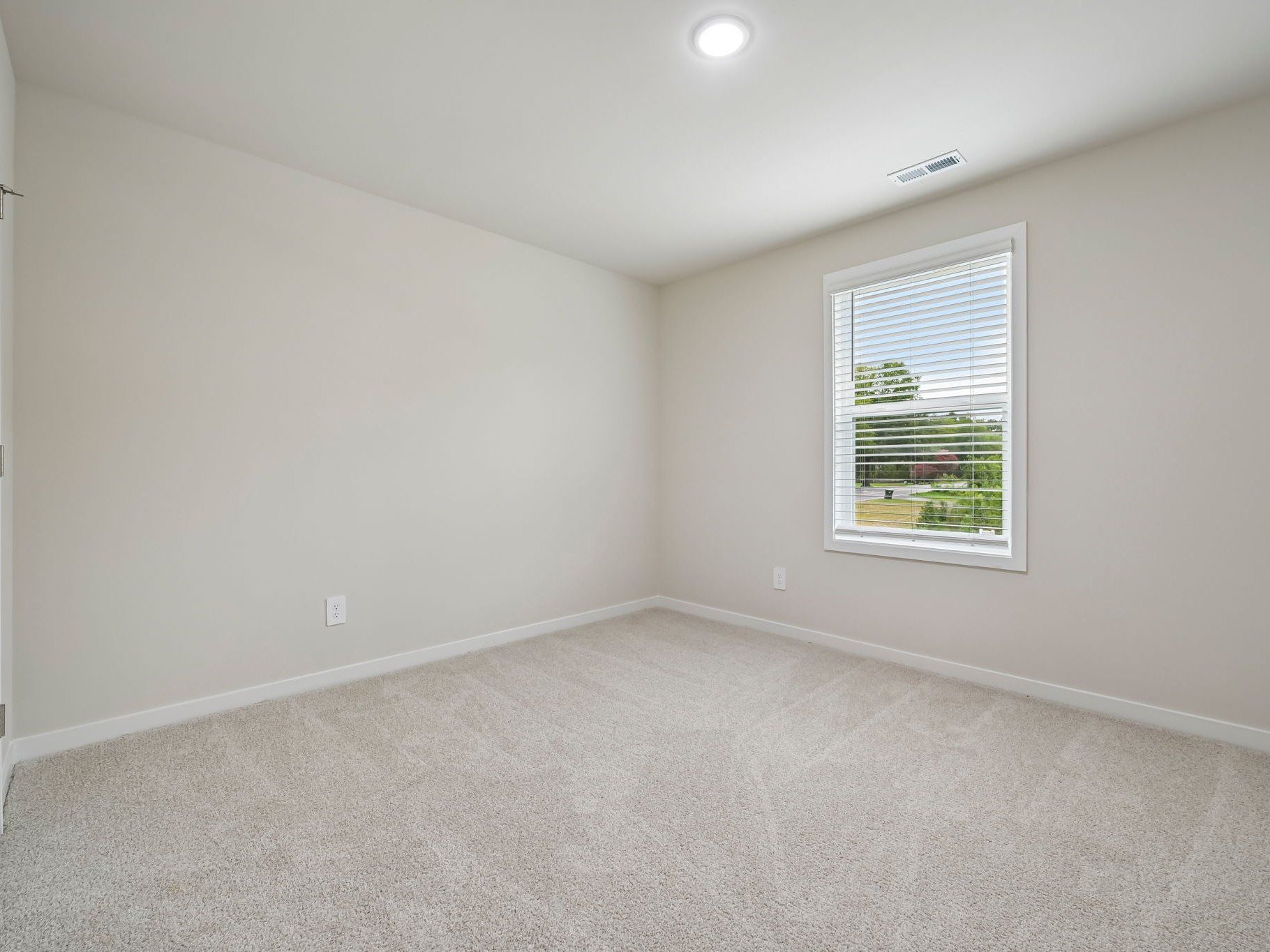 Secondary bedroom in the Chatham floorplan at a Meritage Homes community in Wendell, NC.
