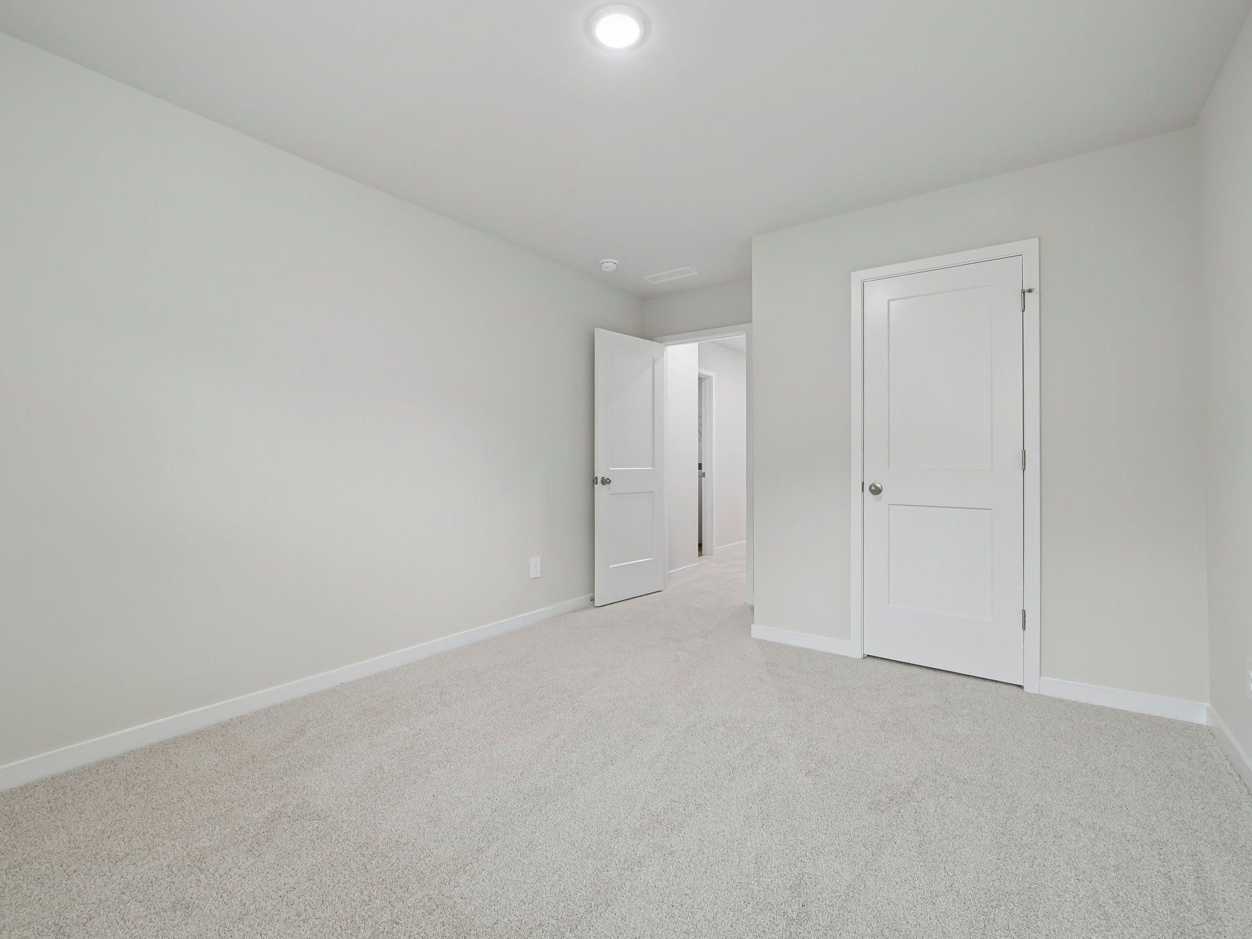 Secondary bedroom in the Chatham floorplan at a Meritage Homes community in Wendell, NC.