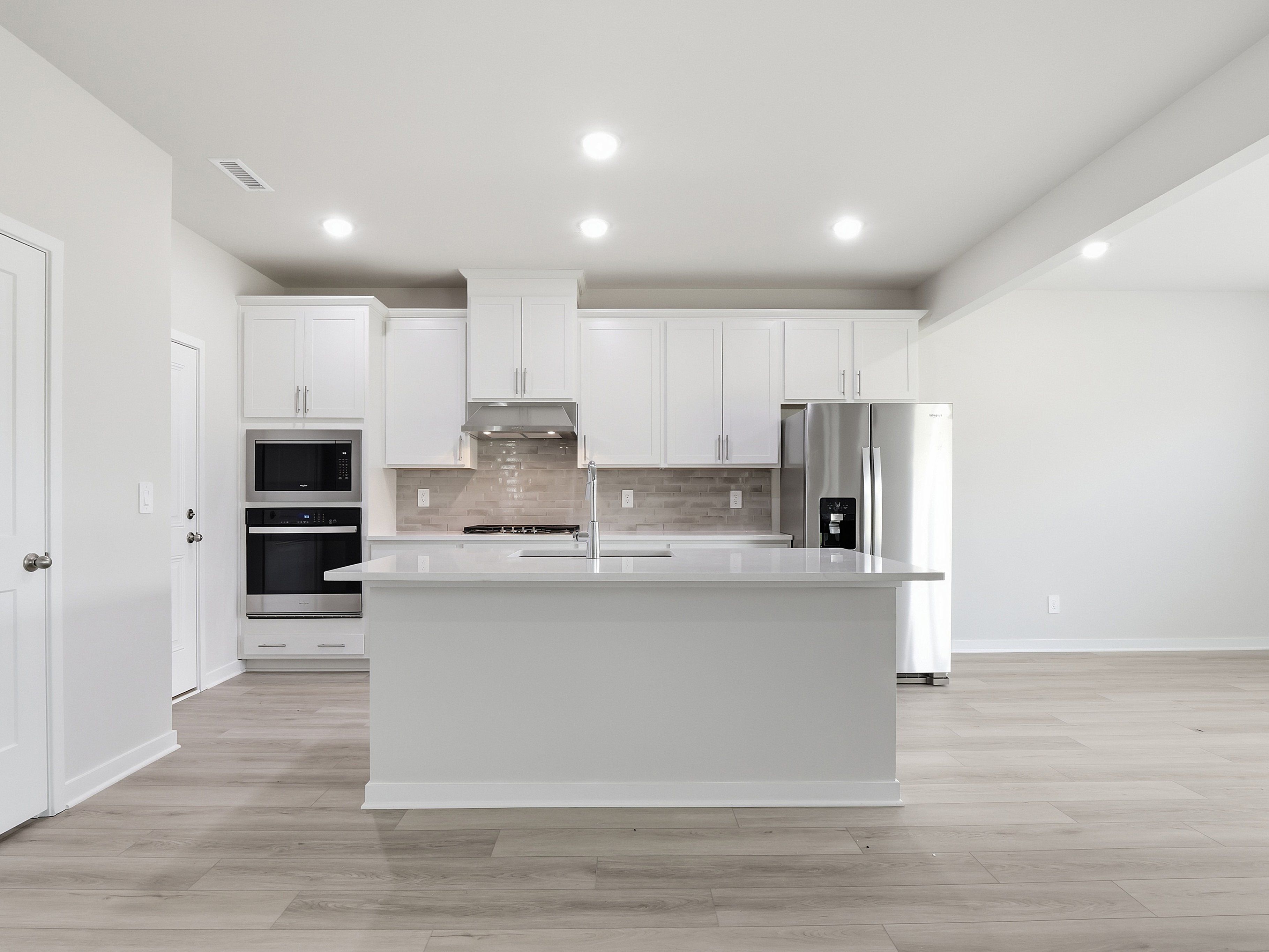 Kitchen in the Dallas floorplan at a Meritage Homes community in Wendell, NC.