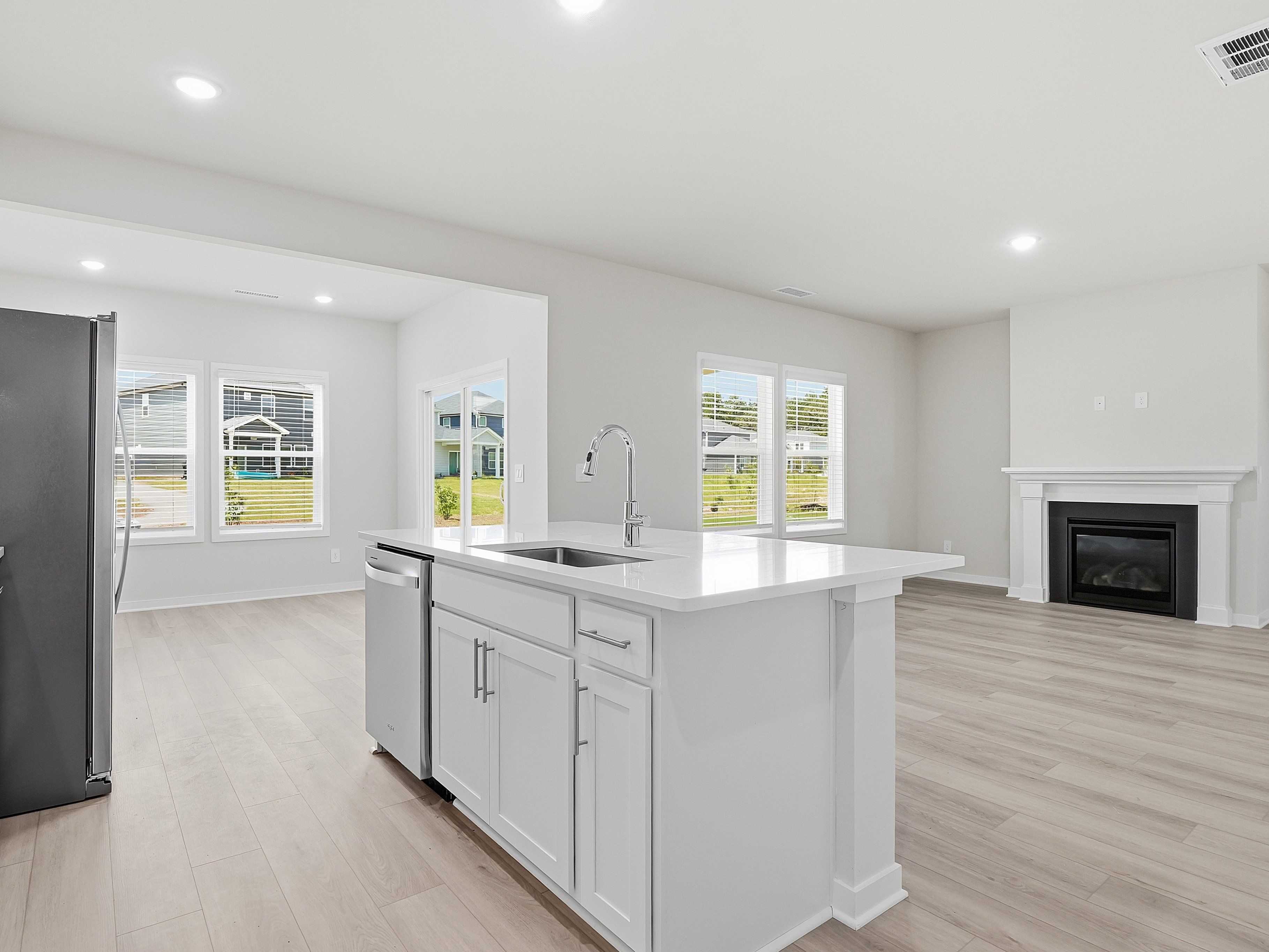 Kitchen in the Dallas floorplan at a Meritage Homes community in Wendell, NC.