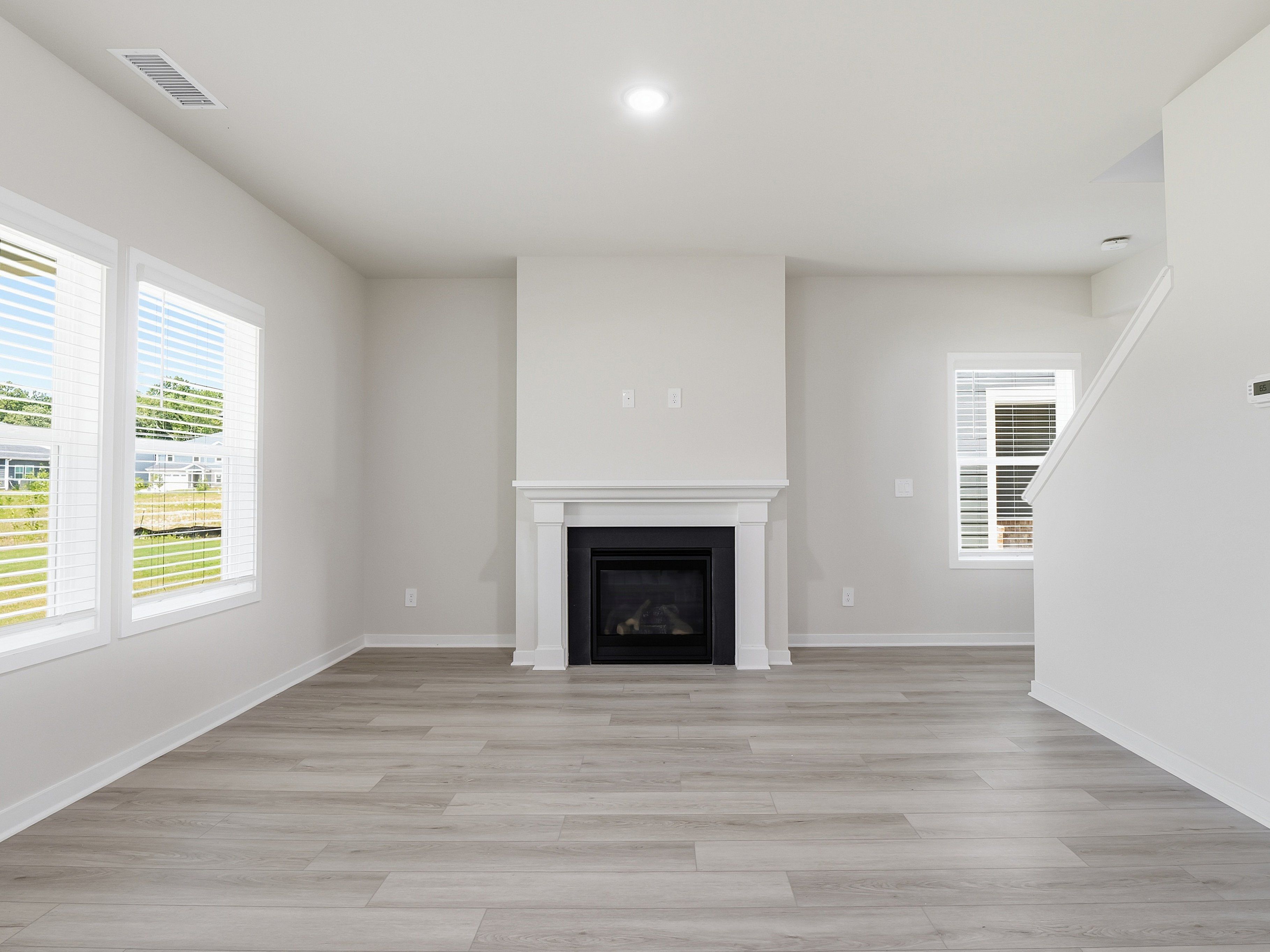 Great room in the Dallas floorplan at a Meritage Homes community in Wendell, NC.