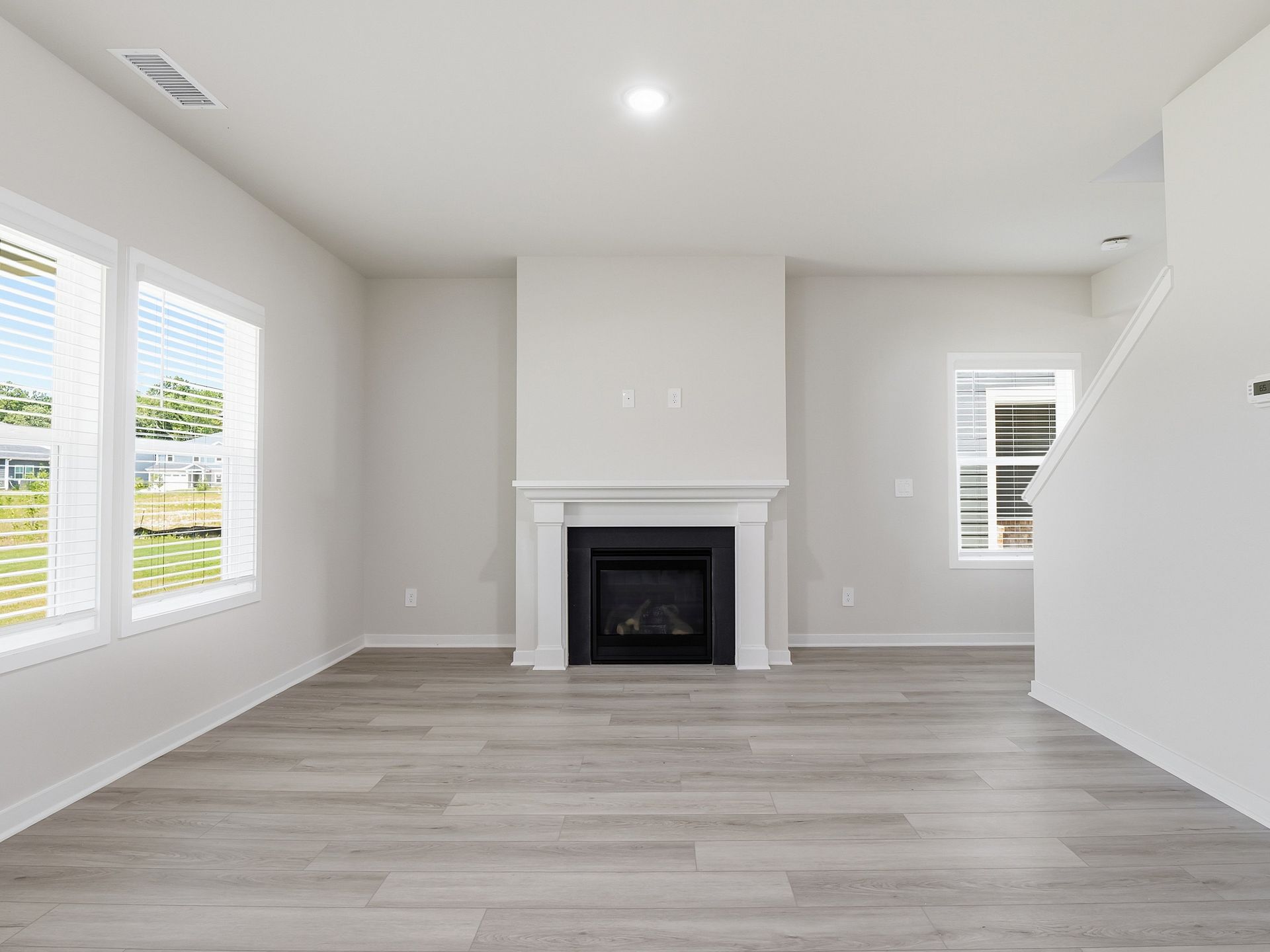 Great room in the Dallas floorplan at a Meritage Homes community in Wendell, NC.
