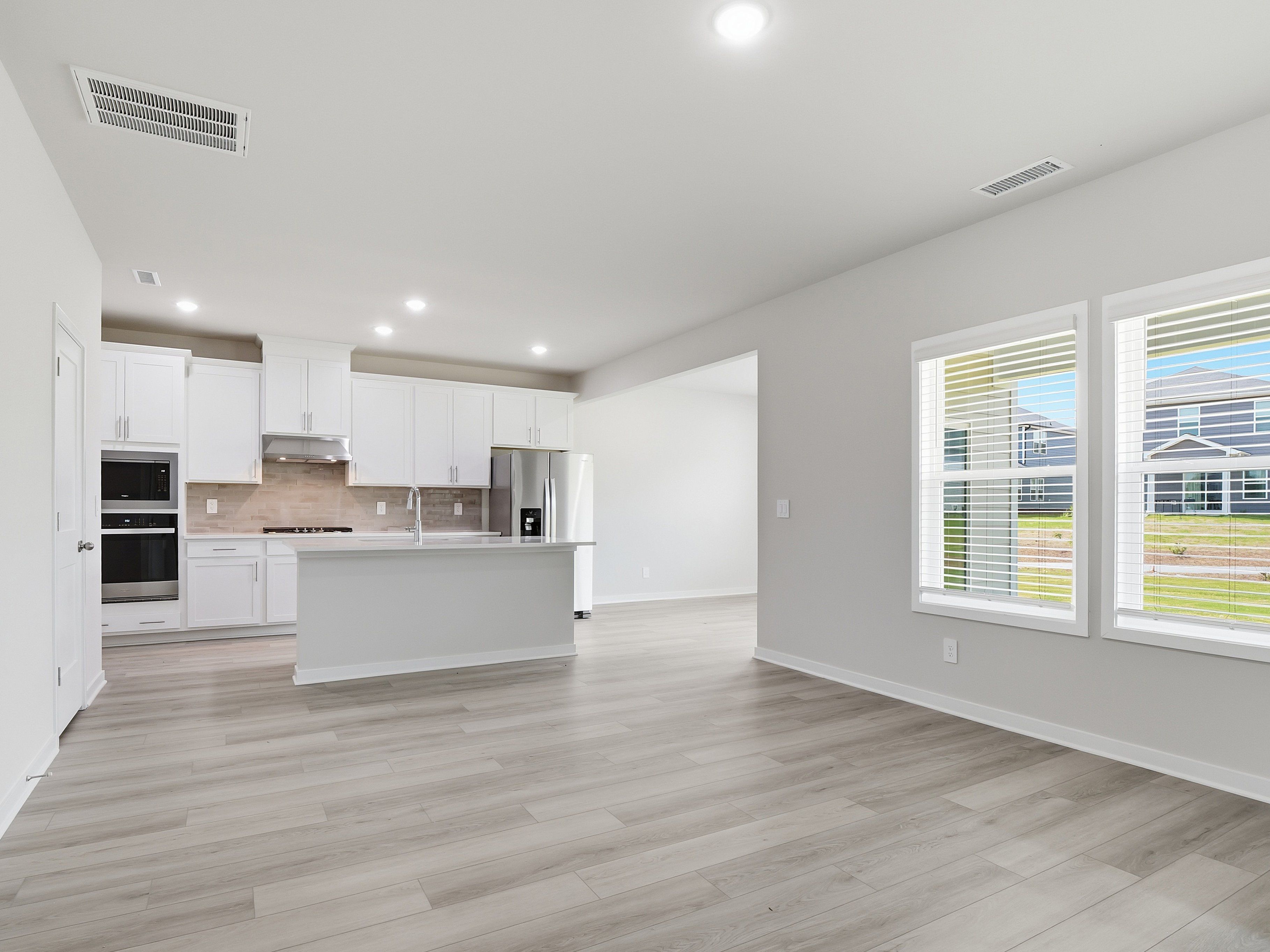 Great room in the Dallas floorplan at a Meritage Homes community in Wendell, NC.