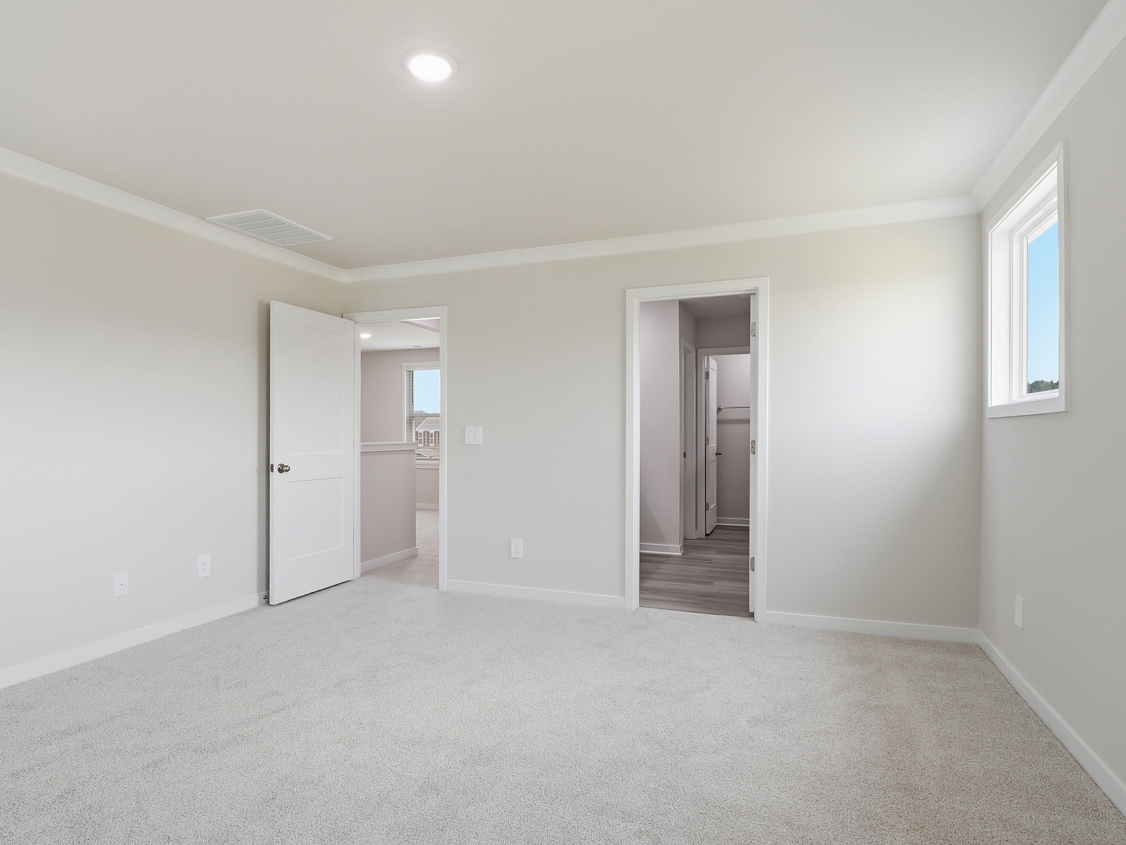 Primary bedroom in the Dallas floorplan at a Meritage Homes community in Wendell, NC.