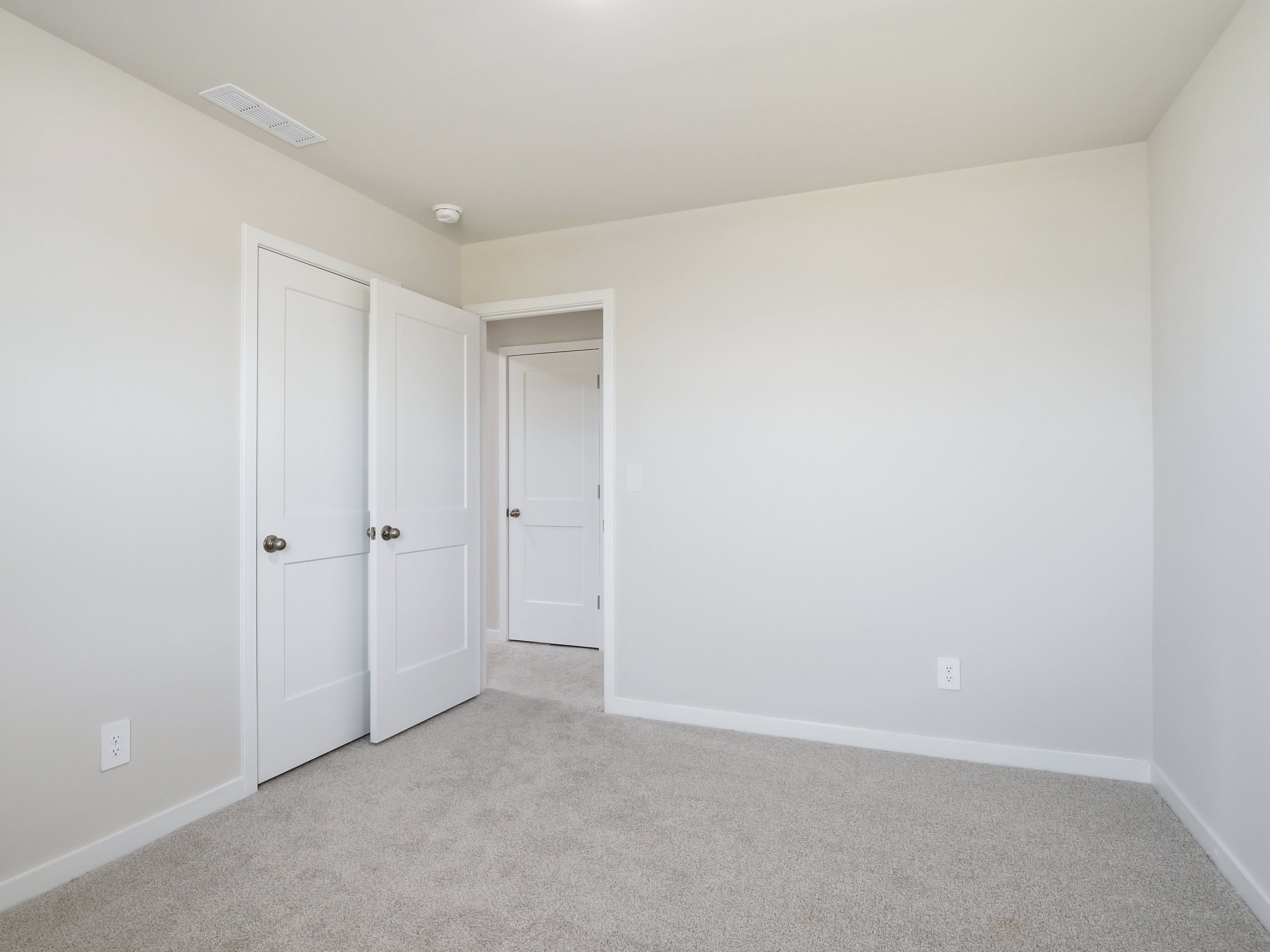 Secondary bedroom in the Dallas floorplan at a Meritage Homes community in Wendell, NC.