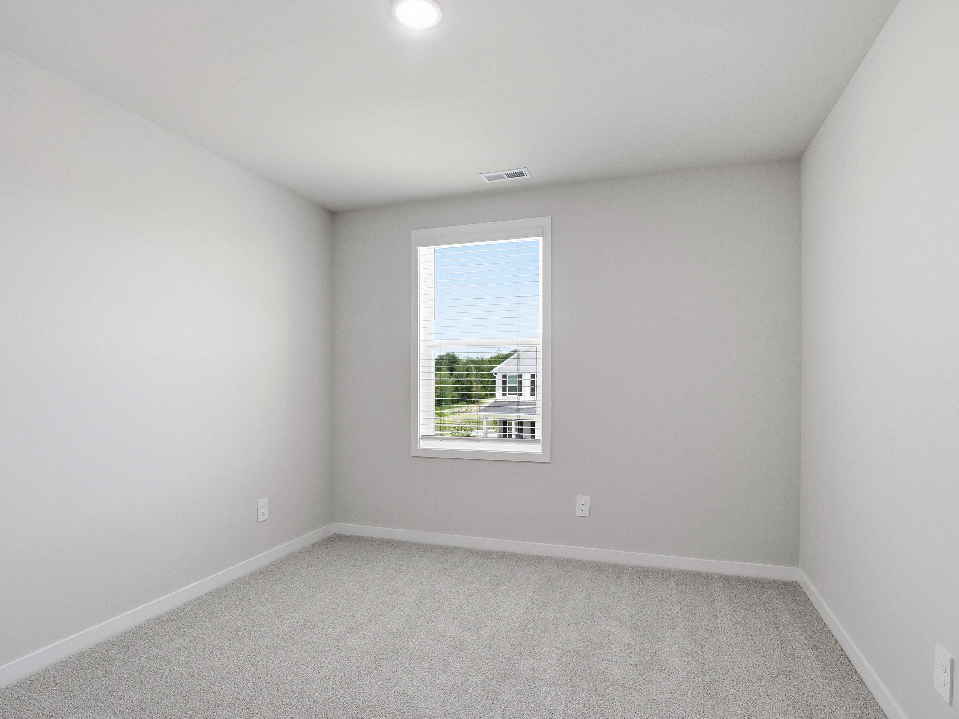 Secondary bedroom in the Dallas floorplan at a Meritage Homes community in Wendell, NC.