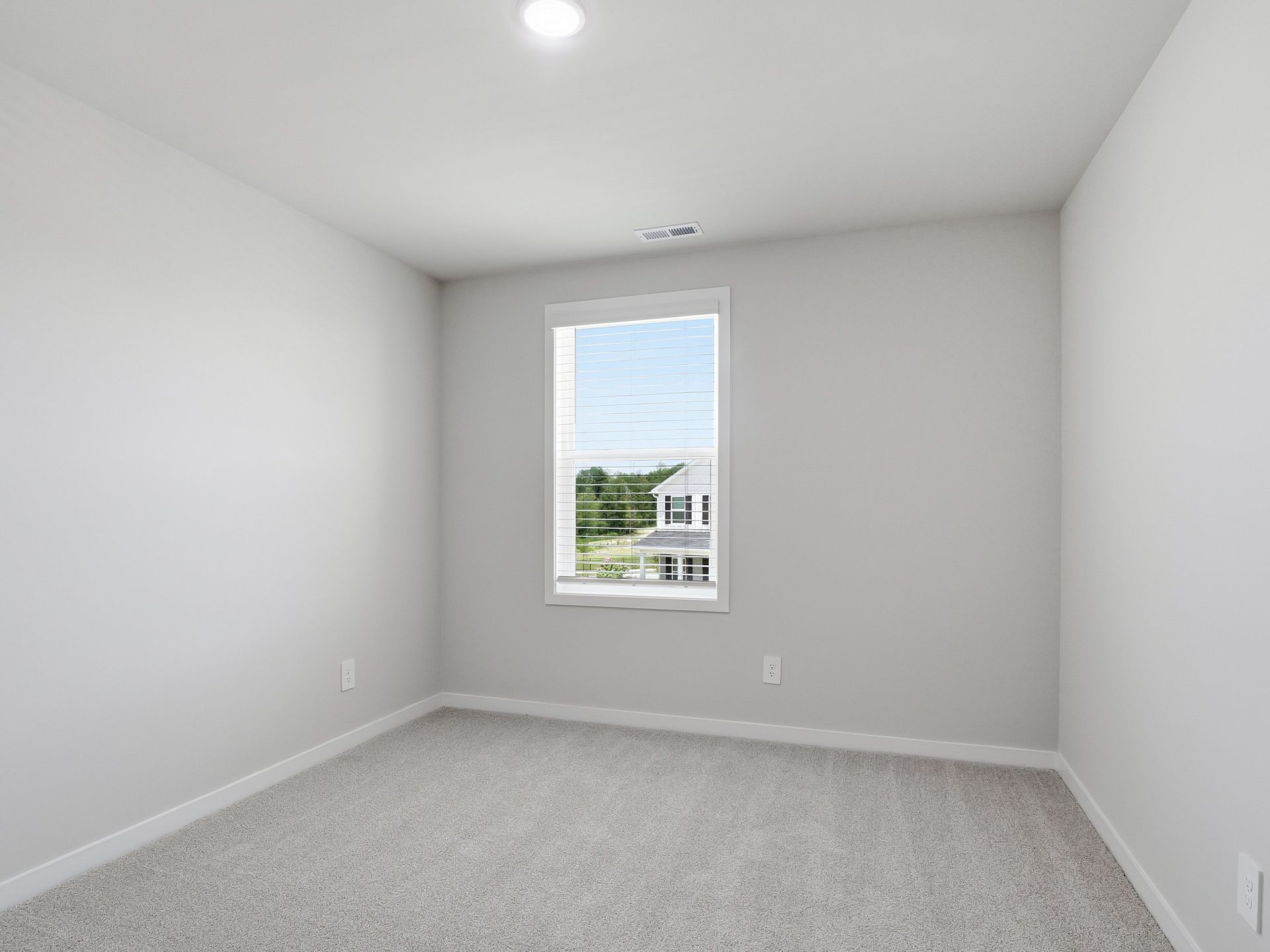 Secondary bedroom in the Dallas floorplan at a Meritage Homes community in Wendell, NC.